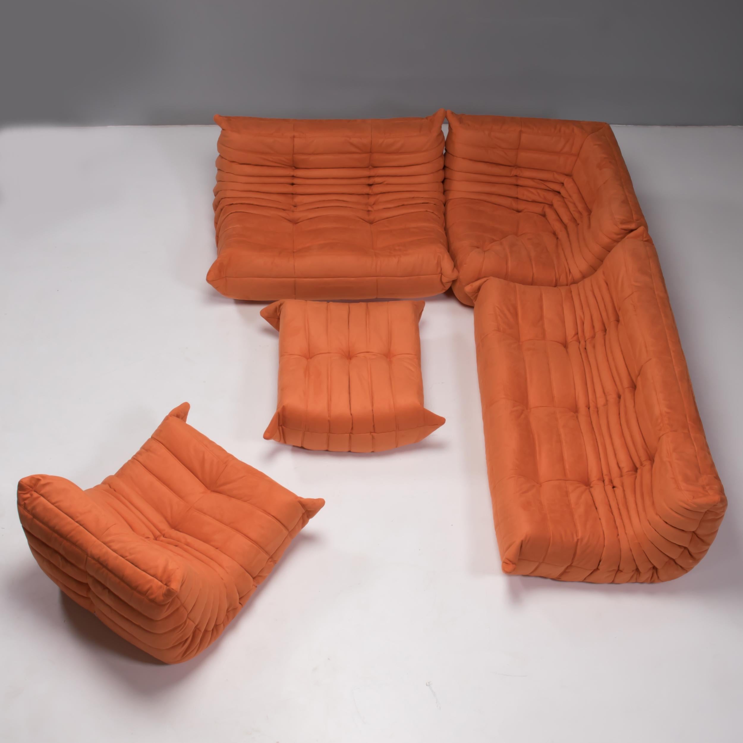 The iconic Togo orange sofa set, originally designed by Michel Ducaroy for Ligne Roset in 1973, has become a design mid century classic.

The sofas have been newly reupholstered in a soft bright orange coloured fabric. Made completely from foam,