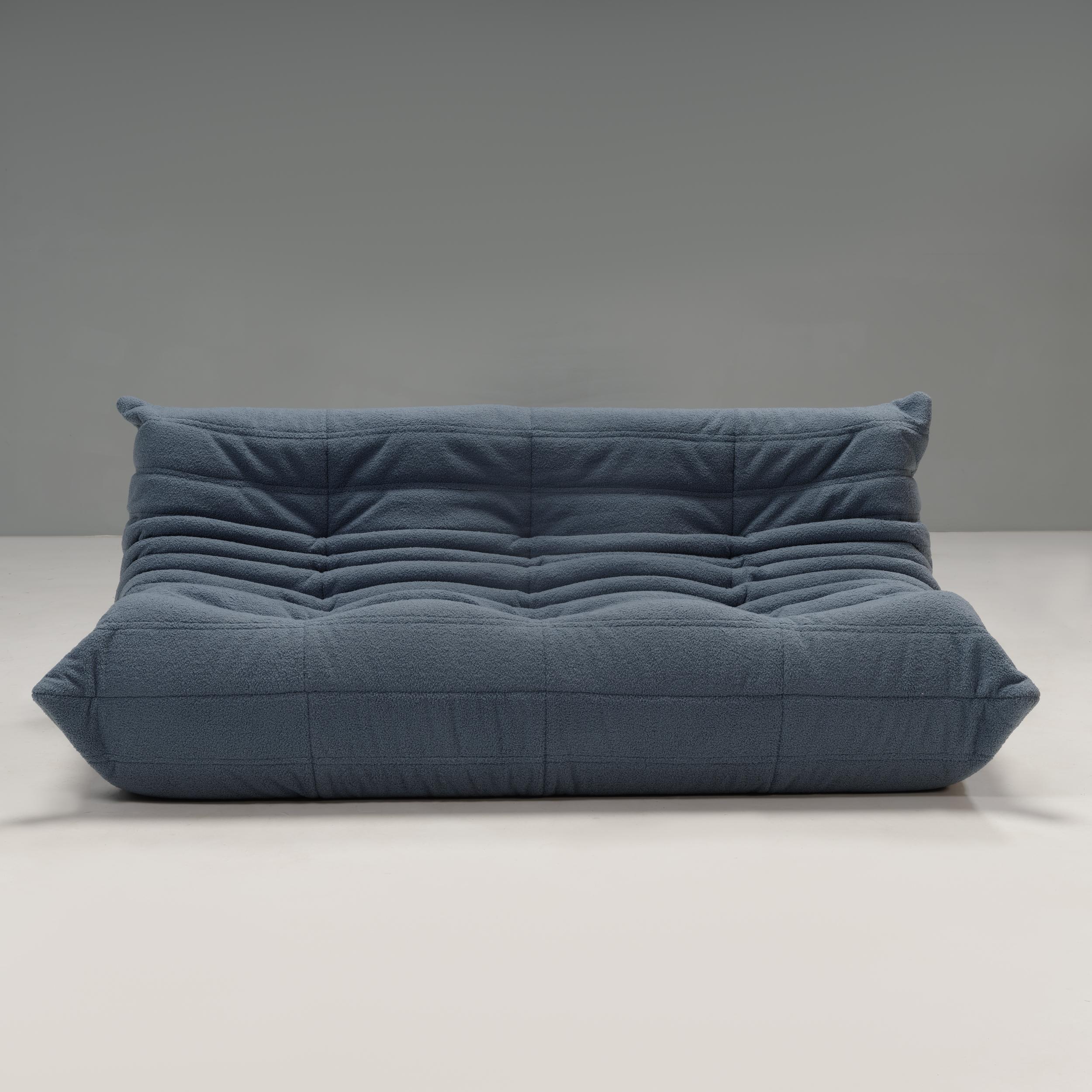 The iconic Togo sofa, originally designed by Michel Ducaroy for Ligne Roset in 1973, has become a design classic. 

This three-seater sofa has been newly reupholstered in extra soft blue bouclé fabric and features the instantly recognisable