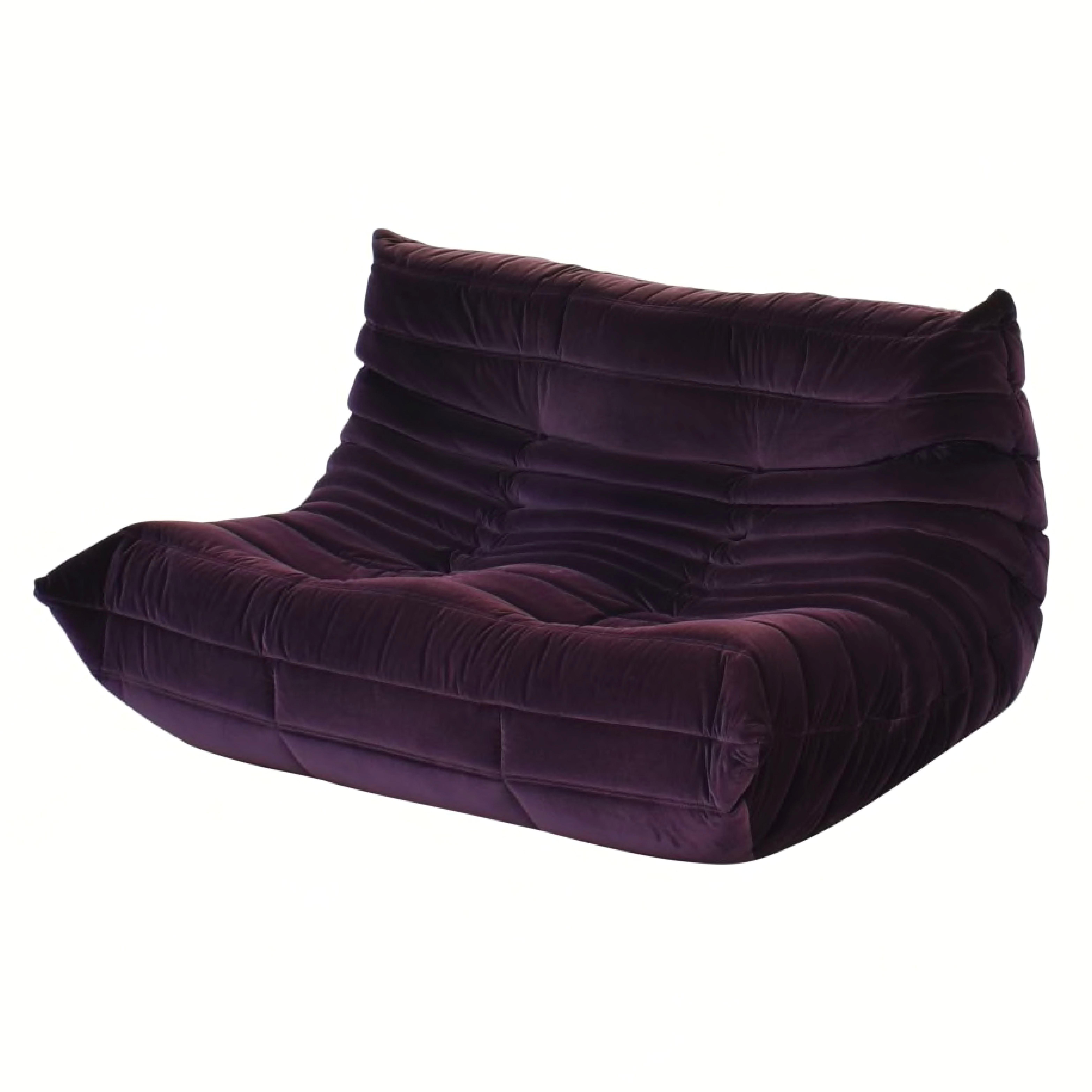 Michel Ducaroy for Ligne Roset Togo Loveseat Sofa, Herald Cassis Purple Velvet. Characteristics
A Ligne Roset classic, Michel Ducaroy's Togo has been the ultimate in comfort and style for over forty years. The timeless collection features an