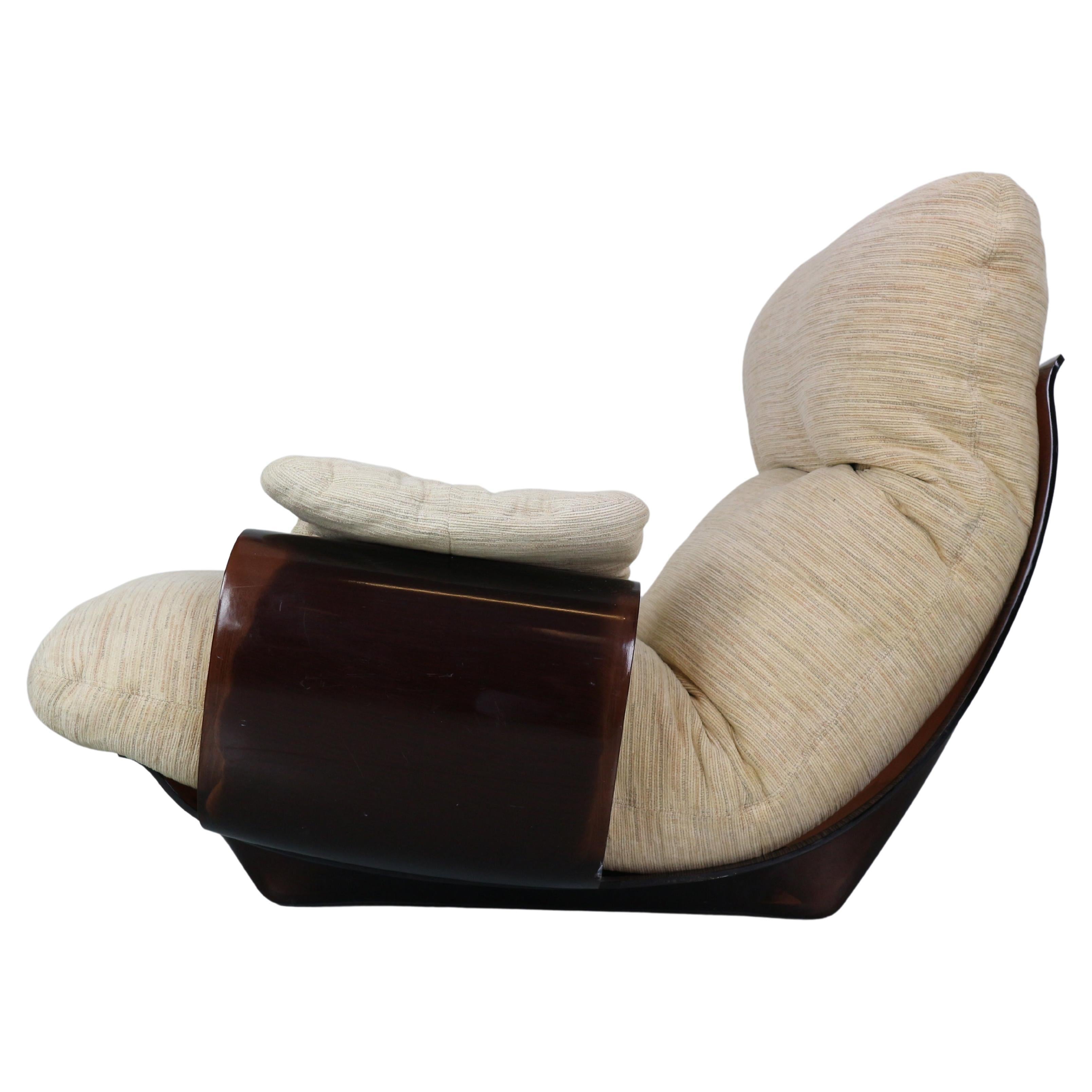 Mid-Century modern period gorgeous armchair designed by Michel Ducaroy and manufactured by famous Frensh furniture manufacture Ligne Roset in 1970s period.

This chair is from the Marsala series and have brown plexiglass base and very cosy fabric