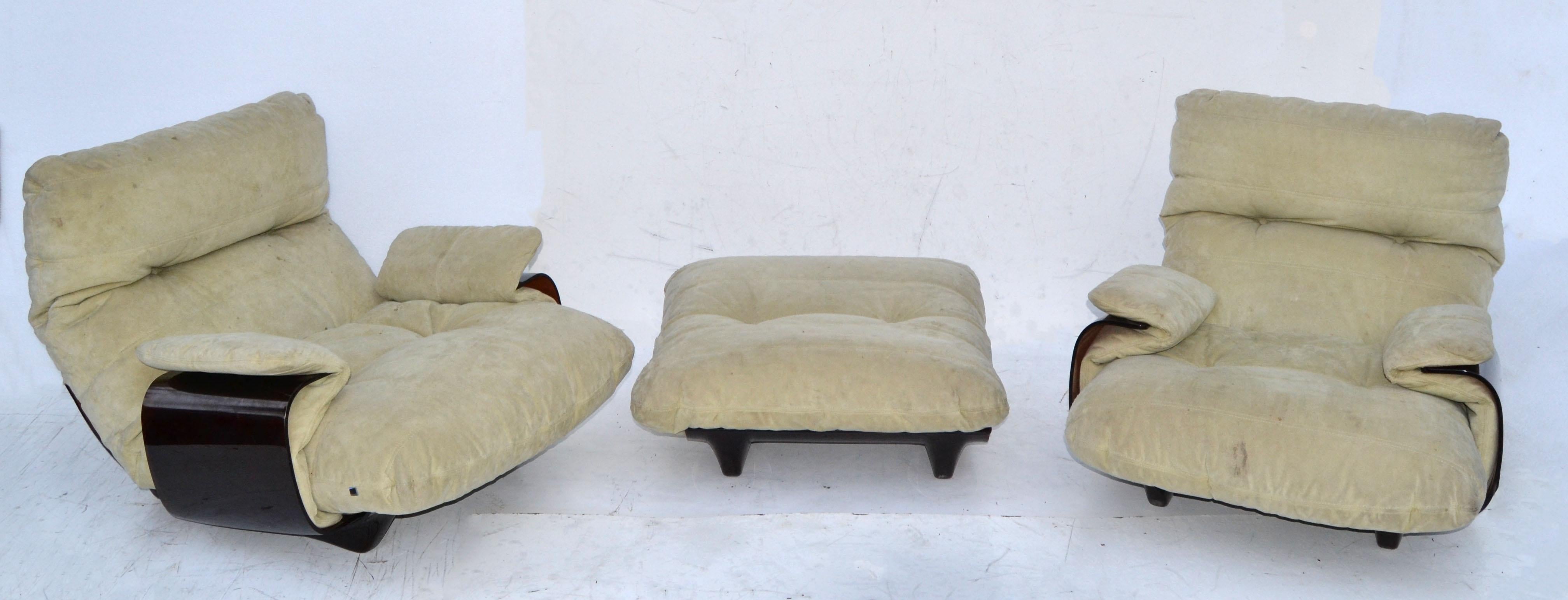 We offer a pair of French Mid-Century Modern 'Marsala' lounge chairs with matching Ottoman by Michel Ducaroy for Ligne Roset. 
The chair features a curved bronze transparent Lucite base and has still the original beige ultra-suede