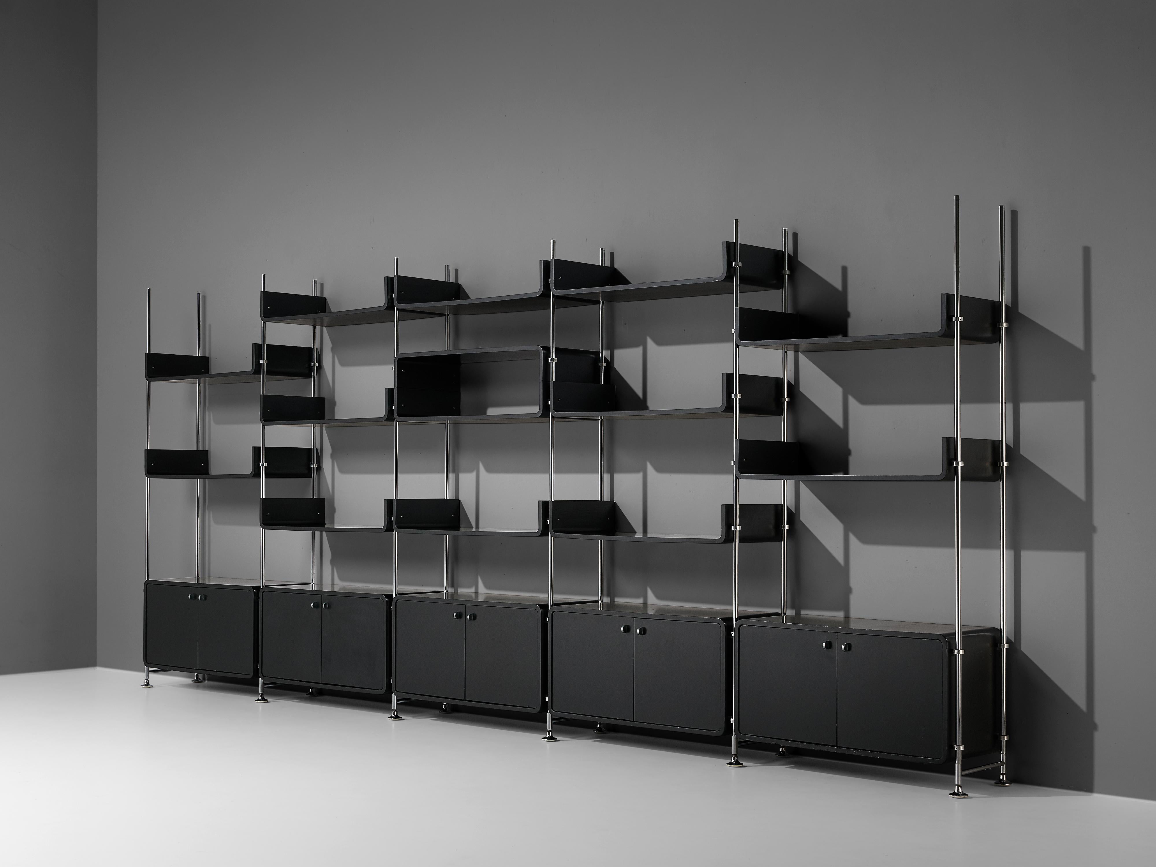 Michael Ducaroy, free-standing wall unit, steel, lacquered wood, France, 1970s

Michael Ducaroy designed this free-standing wall unit in the 1970s. In five columns are five closed cabinets and multiple shelves to find. The black lacquered wood is