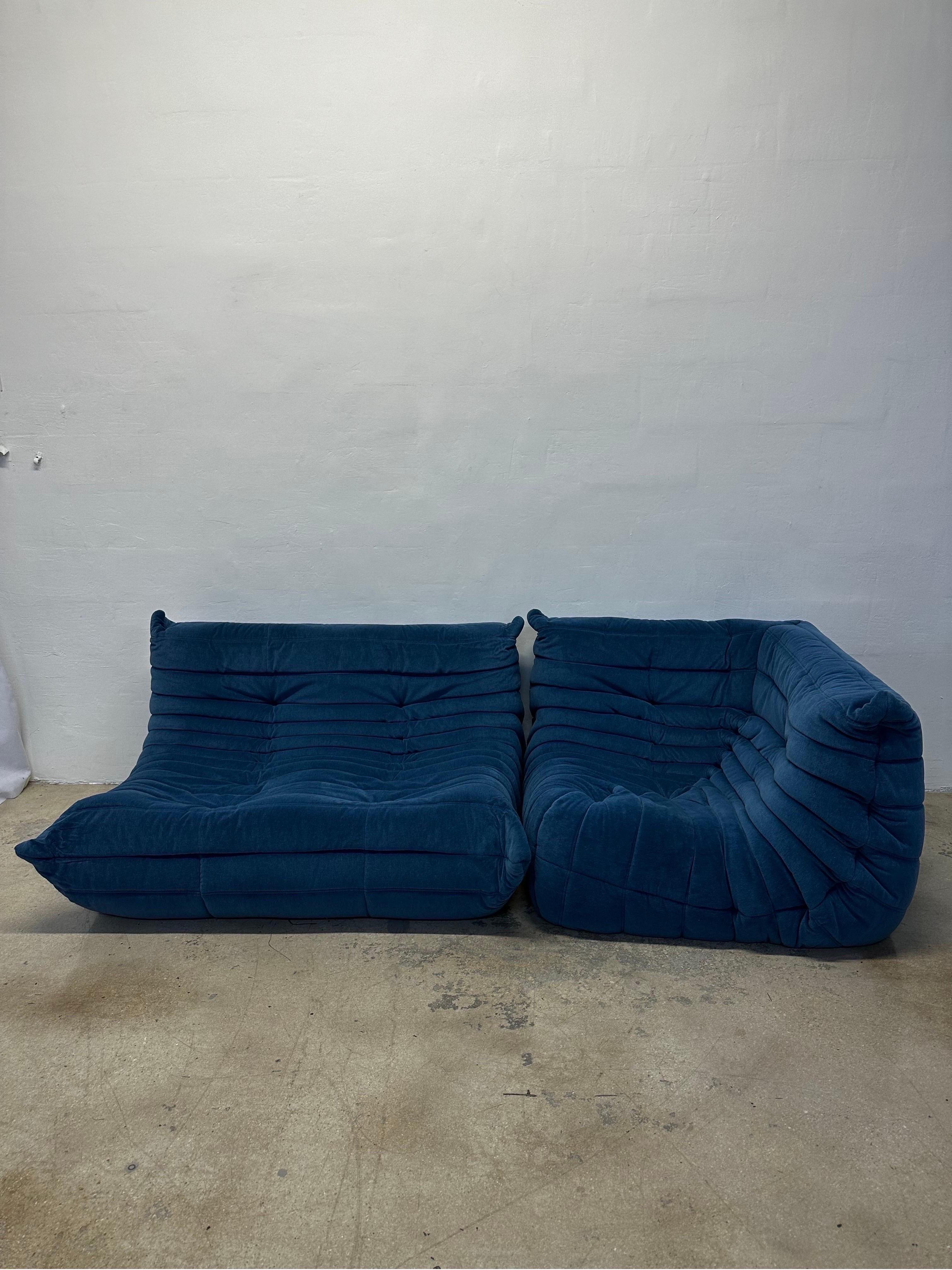 Two piece modular Togo sofa set in blue cotton velvet fabric by Michel Ducaroy for Ligne Roset.  The set comprises of a two seater sofa and single seat fireside chair which can be positioned on either end of the sofa or floating