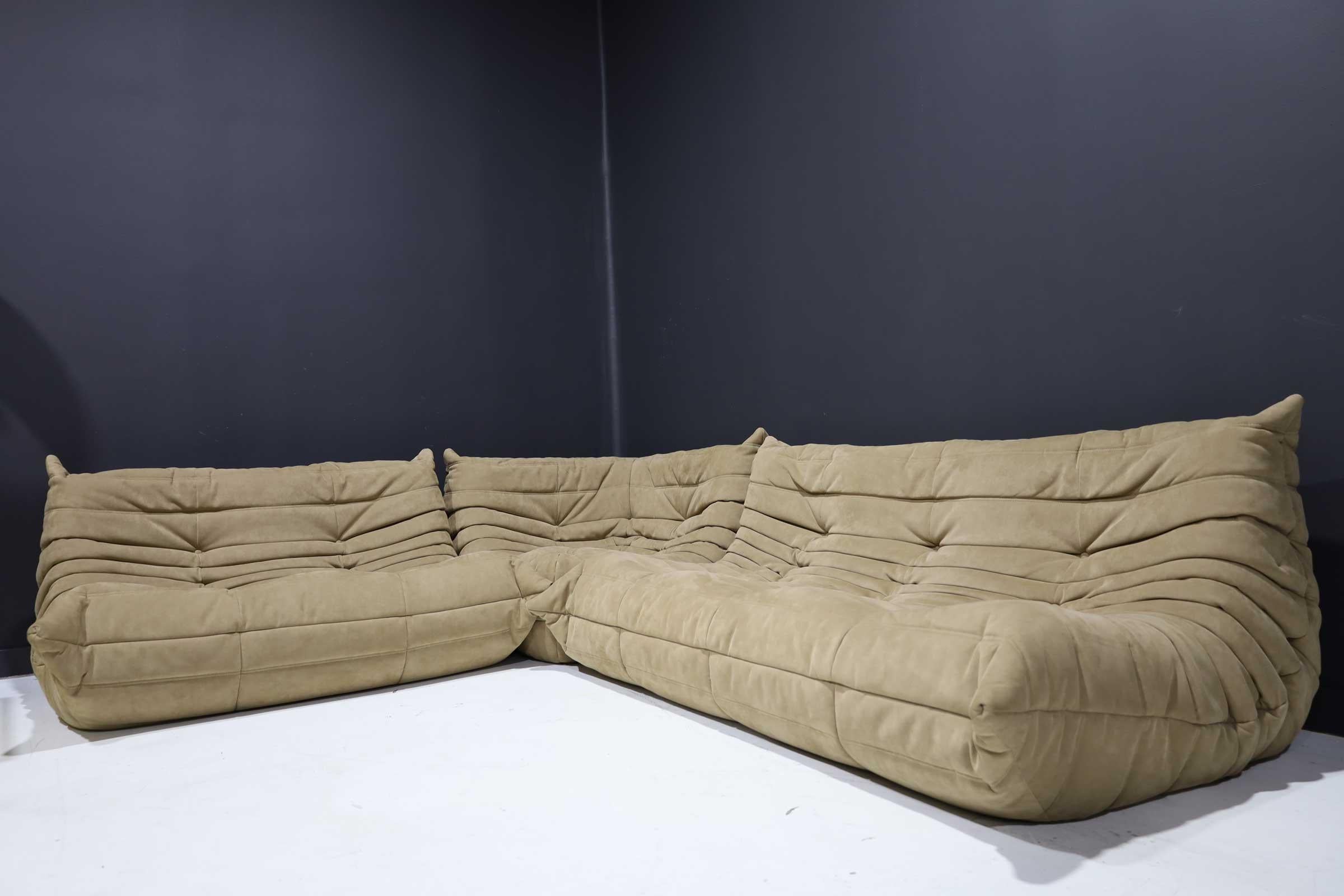 Beautiful 3 section Togo sofa by Michel Ducaroy in tan Alcantara suede. Very clean, like new. Each section measures as follows:

Measures: 2 seater - 28