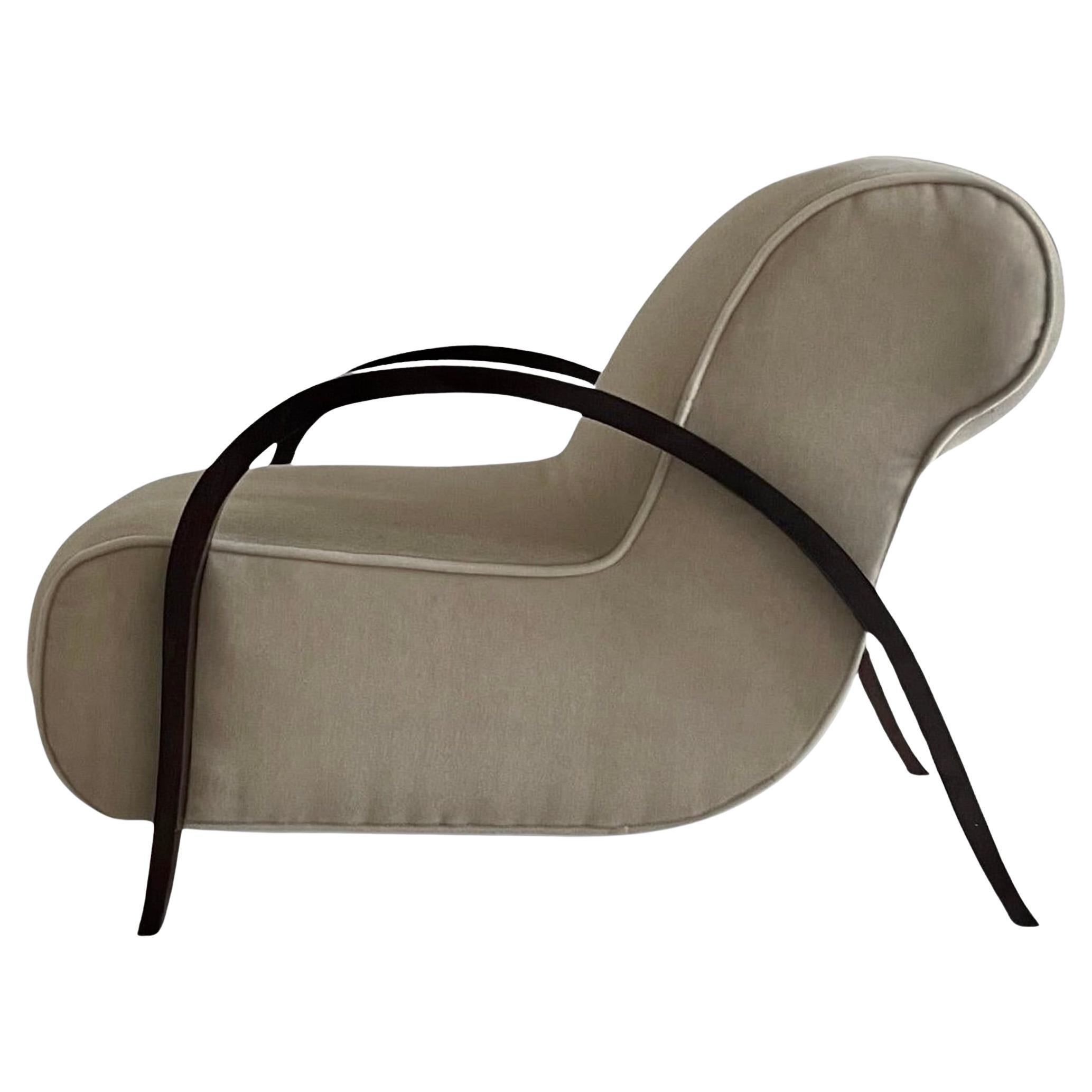 A rare lounge chair designed by Michel Dufet, circa 1930
Two curved arms sweep down to the legs holding a low slung rounded seat, upholstered in taupe mohair. 

Literature
Illustrated, in Michel Dufet Architects Decorateur, by Florence Camard, page