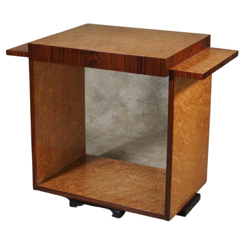 French Modernist Art Deco side table, circa 1930, designed by Michel Dufet and executed in maple burl and rosewood. 29” wide (at sides) x 16” deep x 23” high.

MICHEL DUFET

(1888 – 1985)

Michel Dufet was a renaissance man: architect,