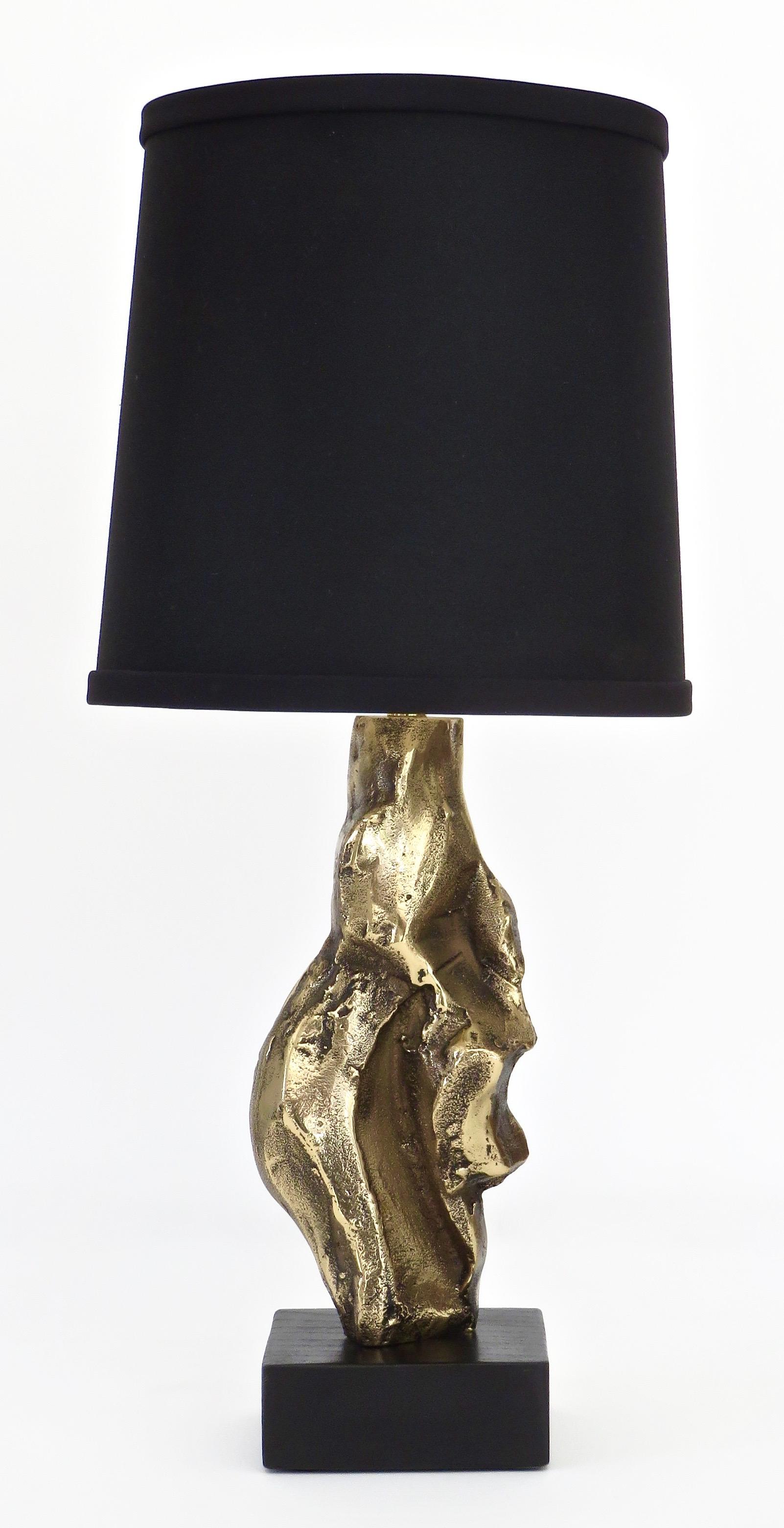 A pair French cast bronze sculptural table lamps, signed M Jaubert, France, circa 1960-1970
Composed of a cast abstract bronze abstract organic sculpture on a black wood base.
Signed near bottom on bronze.
Please note the table lamp has been
