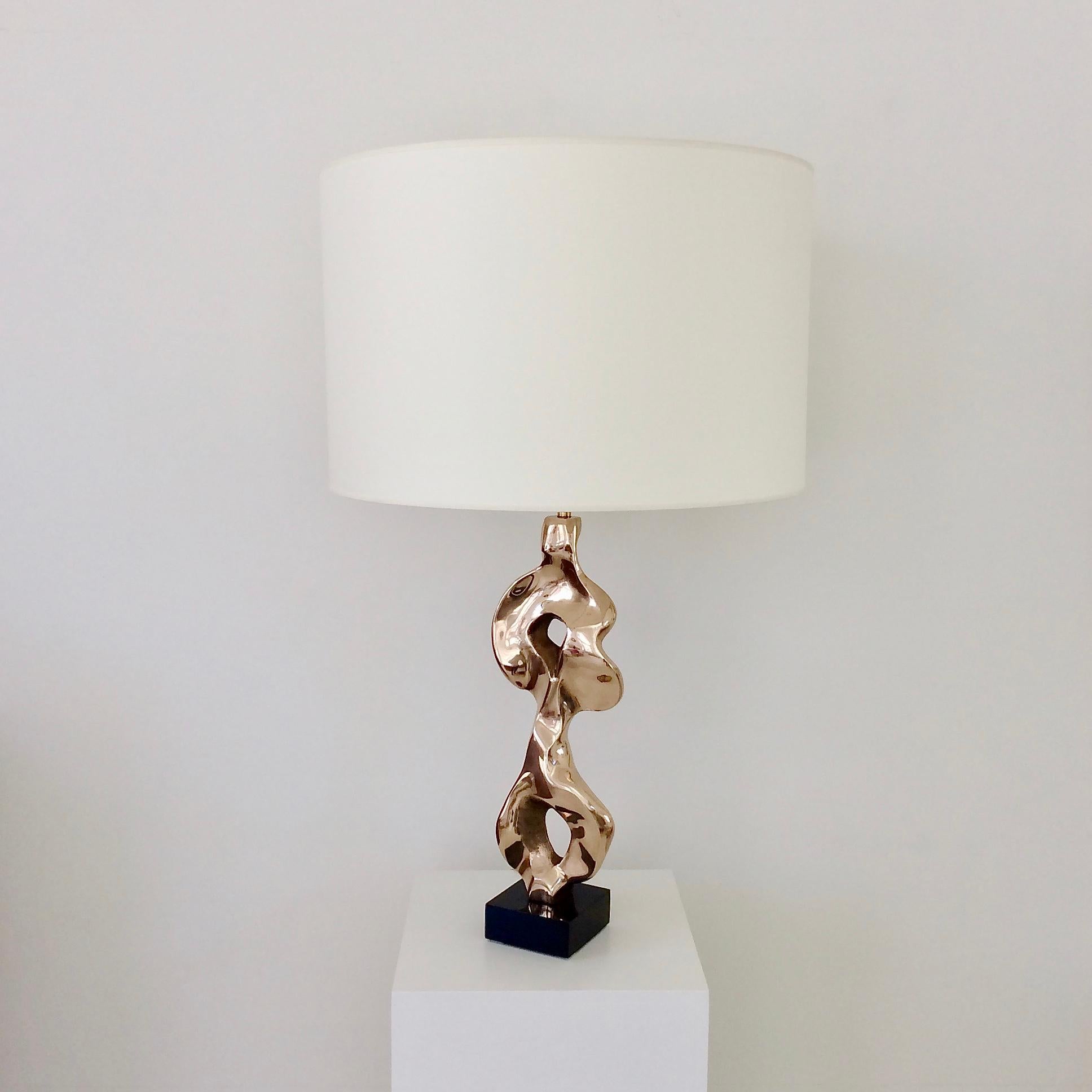 Beautiful Michel Jaubert organic form bronze table lamp, circa 1975, France.
Polished bronze, new ivory fabric shade, blackered wood base.
Stamped M. Jaubert on the bronze.
One E27 bulb of 60 W.
Dimensions: 77 cm H, 47 cm diameter.
All