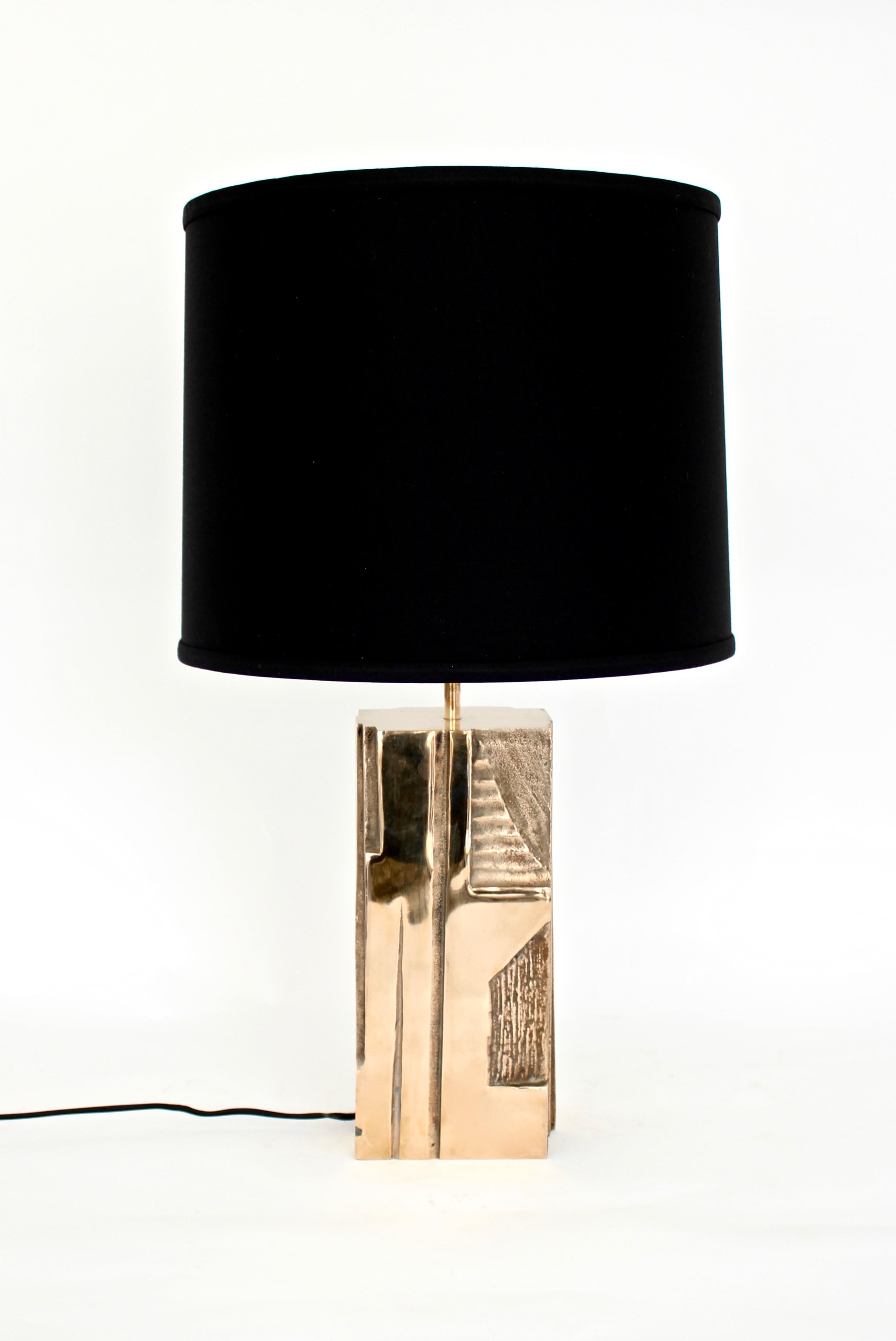 Michel Mangematin French architect pair of French bronze table lamps.
Abstract patterns in the design are recessed and exhibit wonderful variation and texture. These solid bronze table lamps have an amazing abstract modern pattern in the lamp body