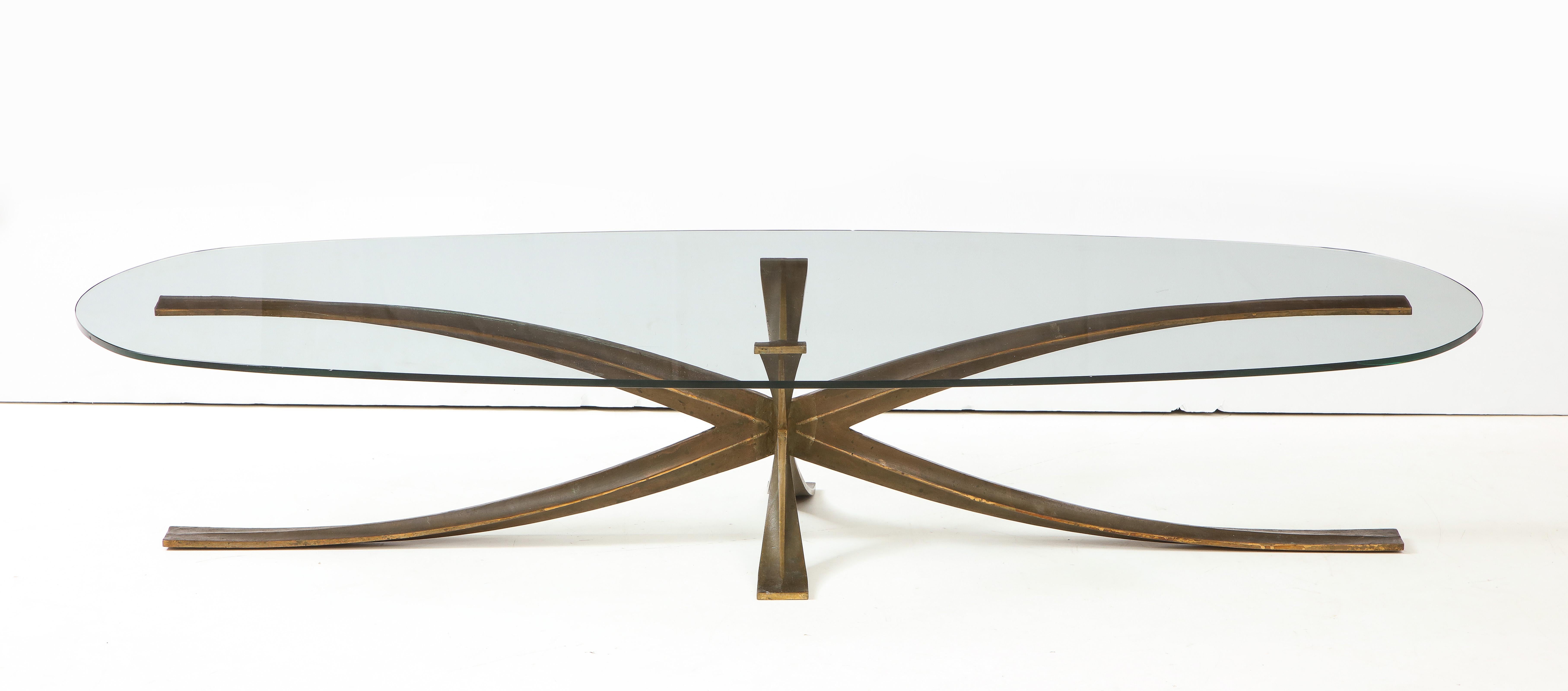 The iconic elongated bronze coffee table by French designer, Michel Mangmatin. His design was influenced by Mies Van deer Rohe’s Barecelona chair.


Michel Mangmatin
France (Born in 1928)
French architect Michel Mangematin settles in the United