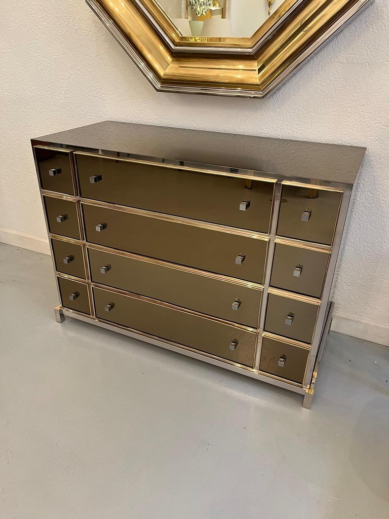 High quality and exquisite glass, brass and chrome chest of drawers by Michel Pigneres, France ca. 1970s
12 smoked glass with brass frame. Chrome handles.
Chrome base.
Very good condition. A very small chips on the back right (picture).
A few