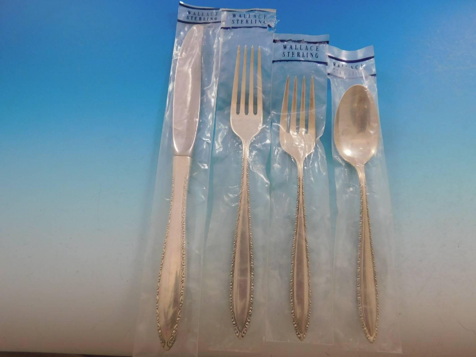 New, unused Michele by Wallace sterling silver flatware set of 33 pieces. This set includes:

Eight knives, 9