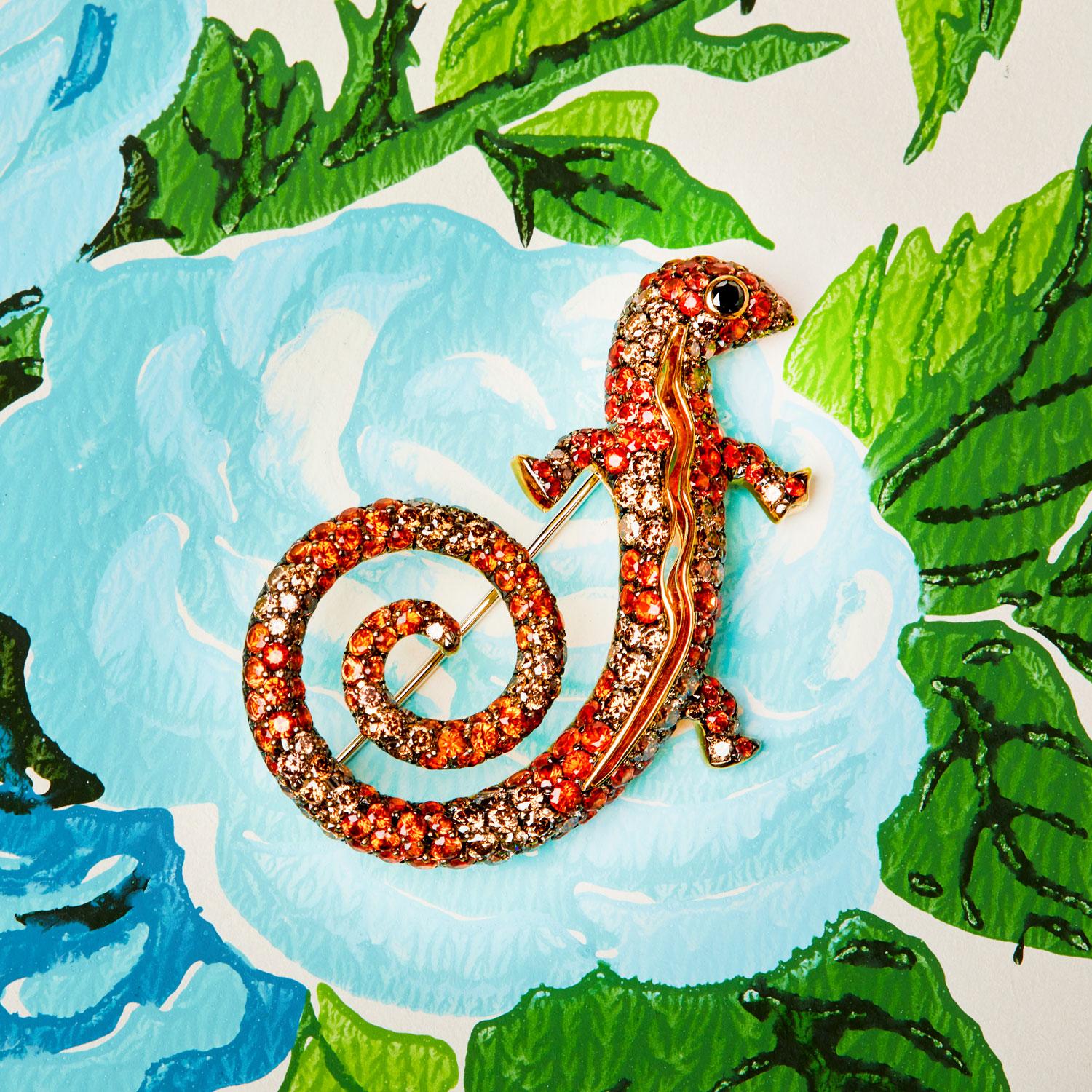 Originally from Rome, where he collaborated with Bulgari on custom work, Michele della Valle is now based in Geneva. This distinctive brooch, designed as a gecko with a curled tail, is set with alternating bands of orange sapphires and brownish