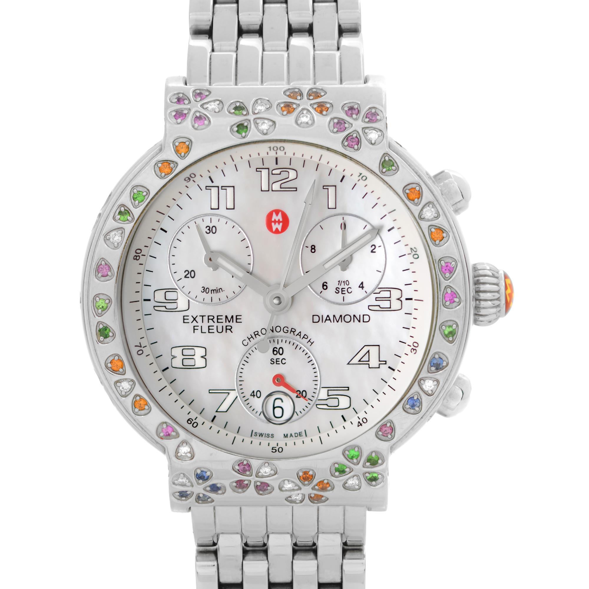 Pre Owned Michele Extreme Fleur Diamond Steel MOP Dial Ladies Quartz Watch MW04A13.  Multi-Color stones Set in flower styles. This Beautiful Timepiece is Powered by Quartz (Battery) Movement And Features: Round Stainless Steel Case Set with Gems