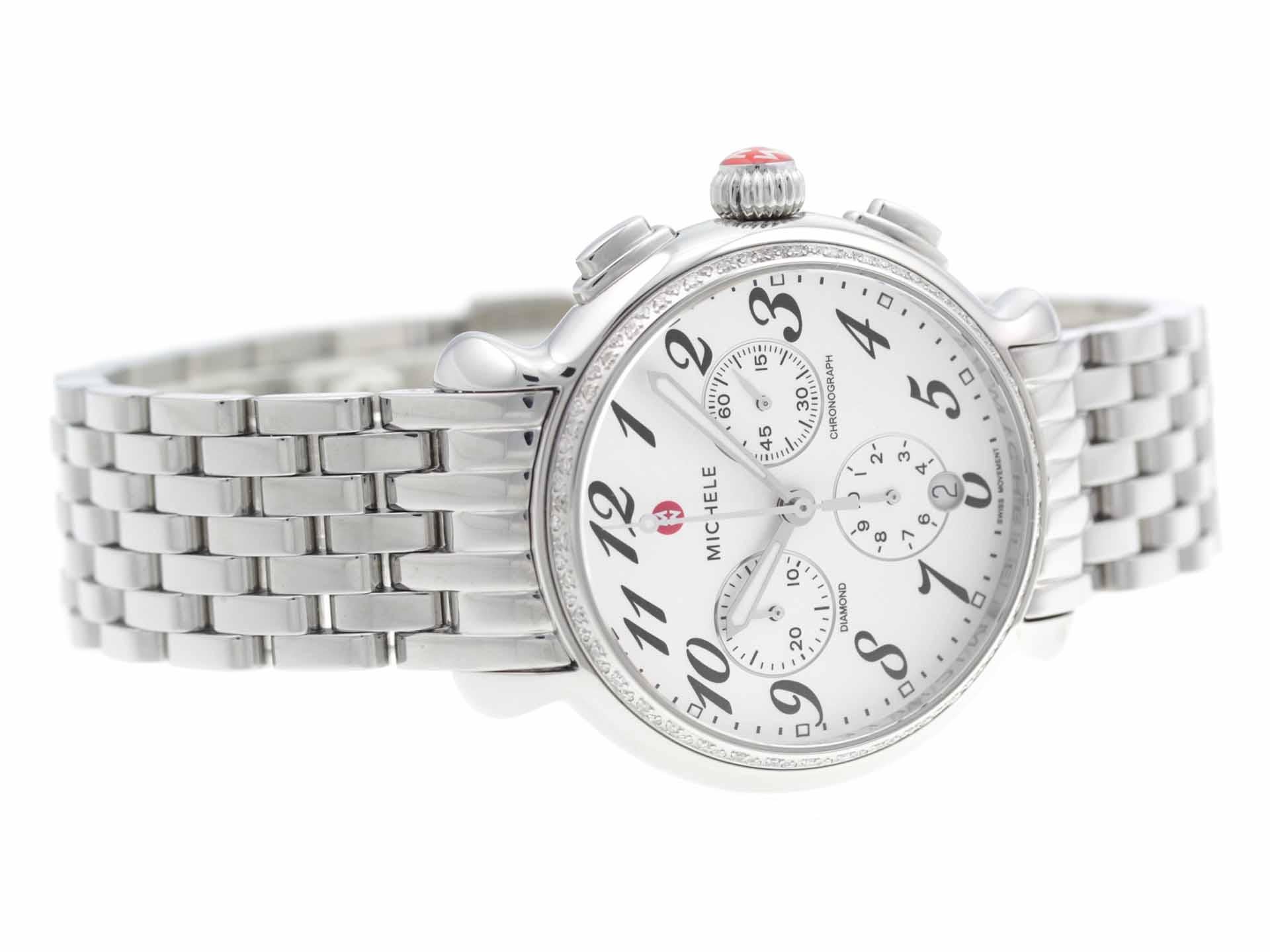 Stainless steel Michele Flutette Chrono watch, with diamond bezel, chronograph, and bracelet.


Brand	Michele
Series	Fluette Chrono
Model	MWW24A000001
Gender	Ladies
Condition	Great Display Model, Light Scratches on Case & Bracelet
Material	Stainless
