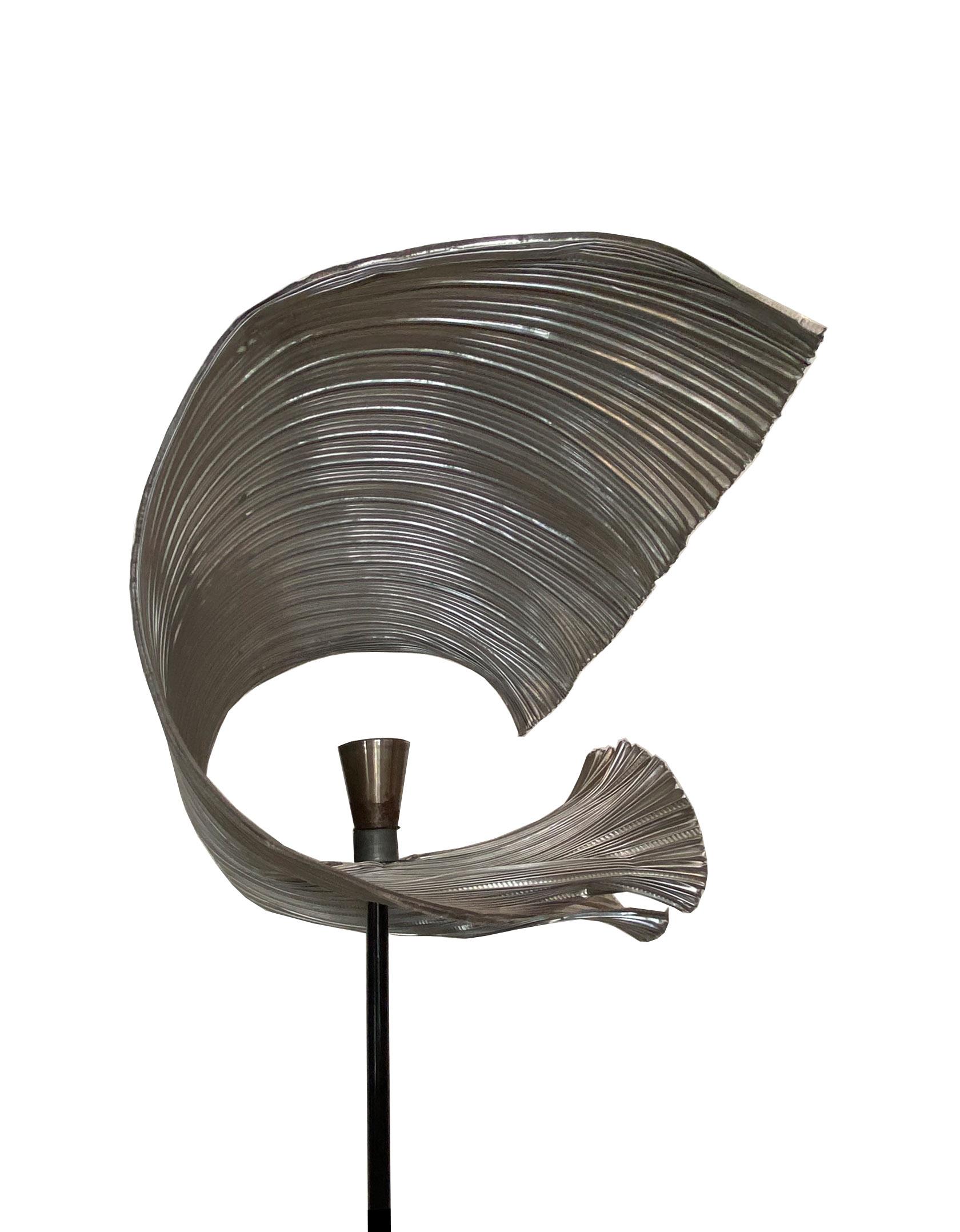Magnificent floor / sculpture lamp by the Neapolitan artist Michele Iodice, made of corrugated aluminum modeled evoking marine forms.
Michele Iodice was born in 1956 in Naples, where he lives and works.

An anomalous artist, not placed in a