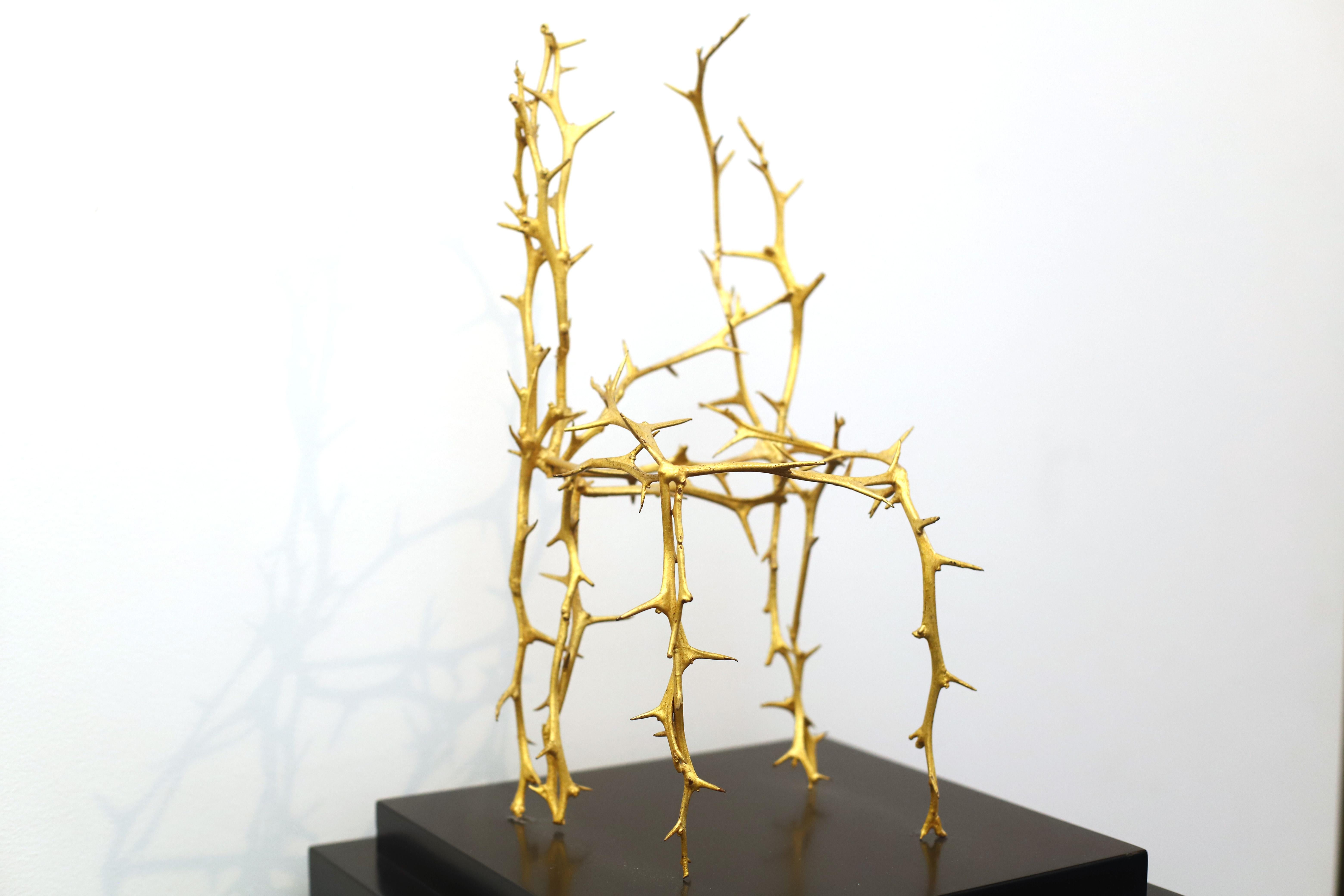 One of Michele Oka Doner chairs from her Terrible Chair Series. Unique bonze wiuth gold leaf sculpture from 1990. Sculpture inpired in nature's thorned branches. The artist is known for the use of natural objects as motifs and metaphors. The