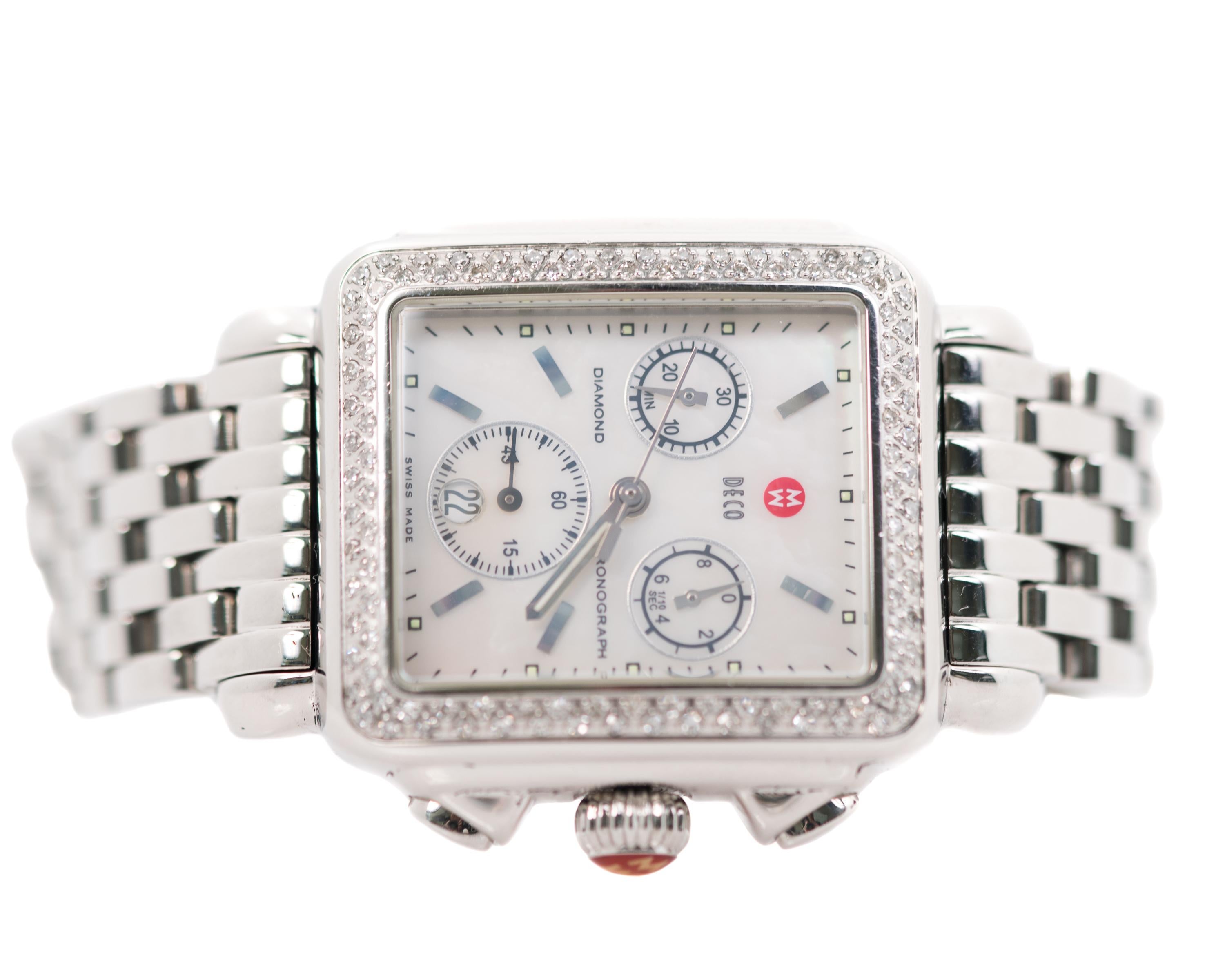 2006 Michele Deco Diamond Ladies Wrist Watch - Stainless Steel, Diamonds
Ref. MW06A01

Features:
0.60 carats total weight Diamonds
Mother of Pearl Dial
Stainless Steel Case and Bracelet
3 Subdials
Date Window at 6:00
Silver Hands and Hour Markers