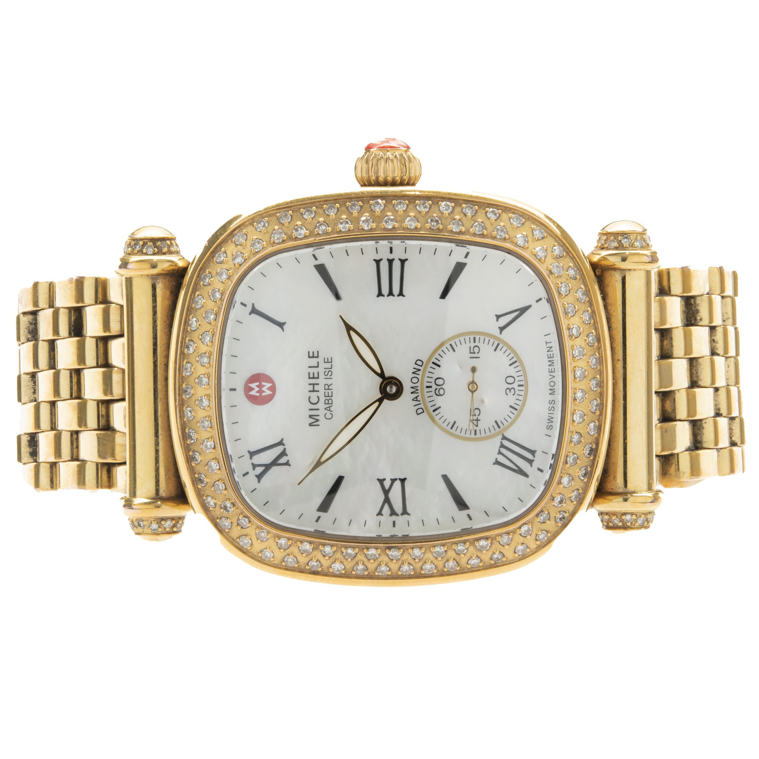 Movement: quartz
Function: hours, minutes, seconds 
Case: 36x32mm stainless gold plated oval case, diamond bezel, sapphire crystal
Dial: mother of pearl roman dial
Band: Michele stainless steel gold plated mesh bracelet, deployment clasp
Serial #:
