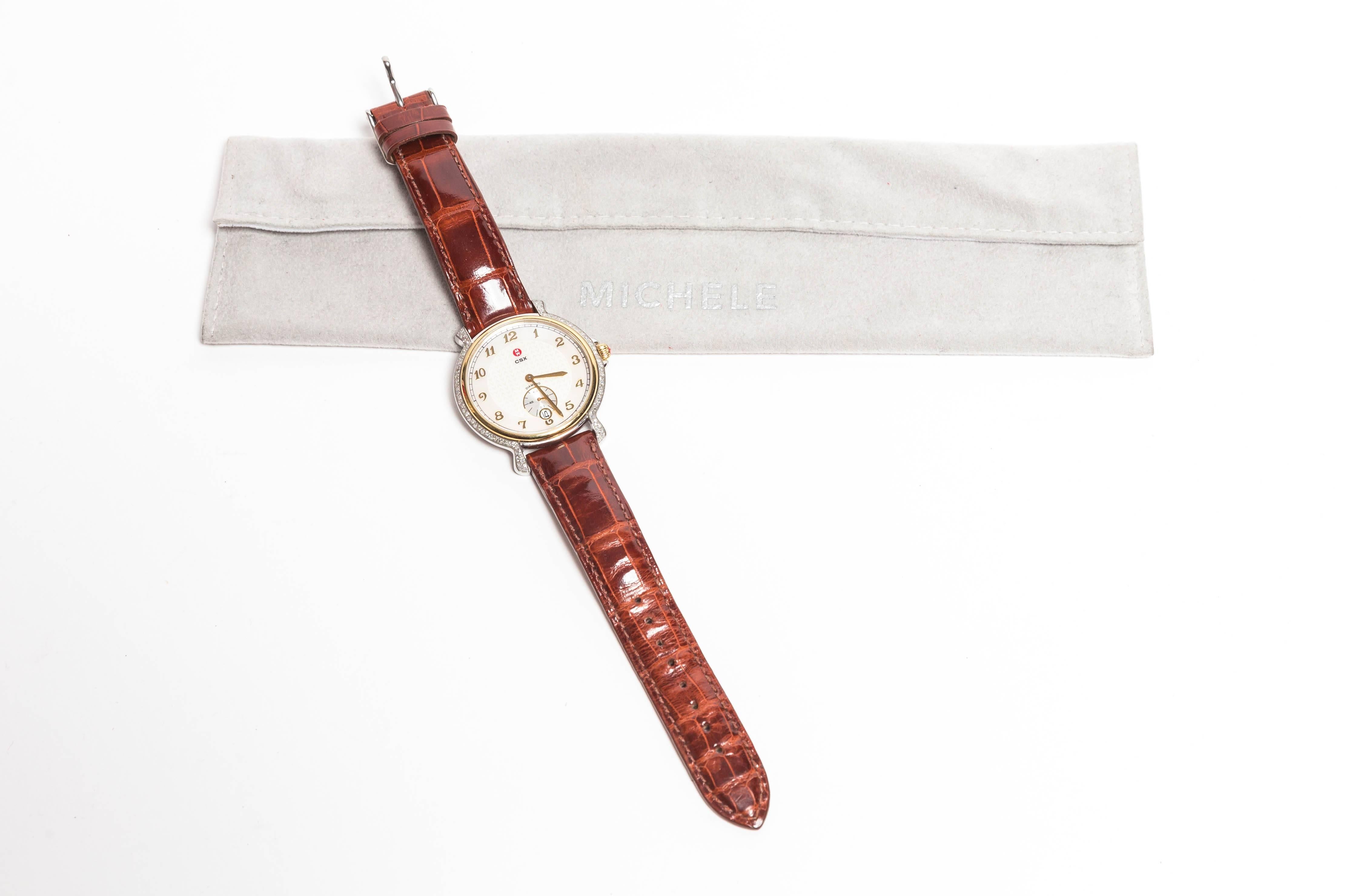 Michele Stainless Steel Watch with Date and Second Hand with Brown Alligator Strap
Diamonds accent the diameter and bezels of this gorgeous watch
Serial No CH02798SS
A service is required