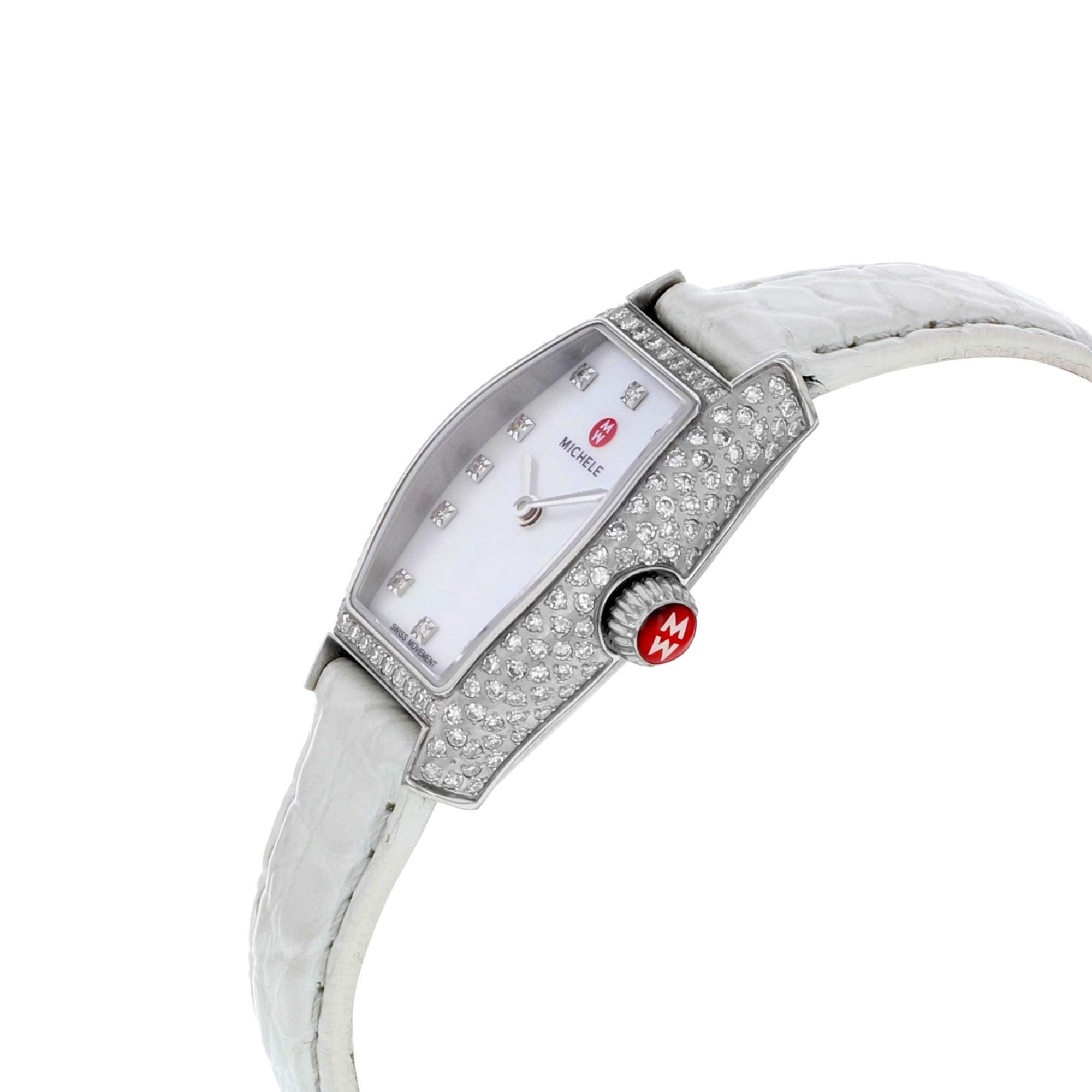 This display model Michele Urban MWW08A000223 is a beautiful Ladies timepiece that is powered by a quartz movement which is cased in a stainless steel case. It has a tonneau shape face, diamonds dial and has hand diamonds style markers. It is