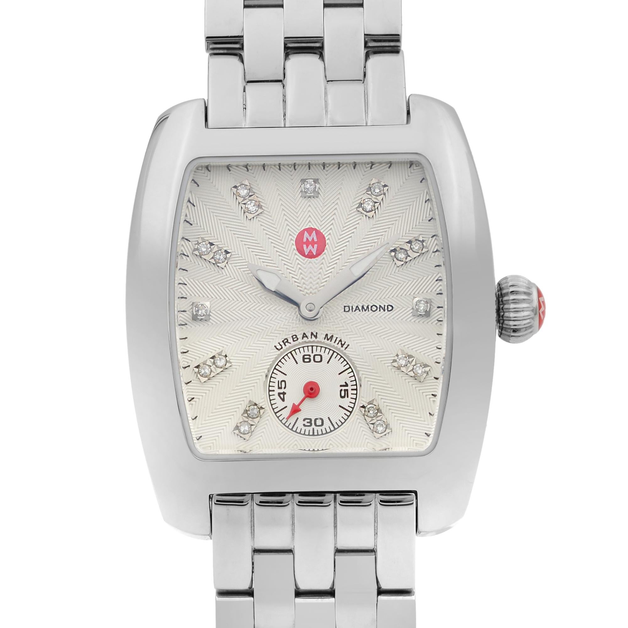 This New Without Tags Michele Urban Mini MWW02A000502 is a beautiful Ladie's timepiece that is powered by quartz (battery) movement which is cased in a stainless steel case. It has a tonneau shape face, small seconds subdial dial, and has hand