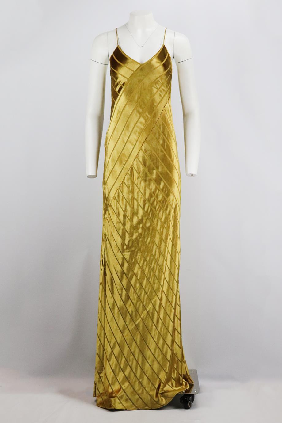 Michelle Mason open back velvet maxi dress. Metallic mustard-yellow. Sleeveless, v-neck. Lace up fastening at back. 82% Rayon, 18% silk; lining: 100% silk. Size: US 10 (UK 14, FR 42, IT 46). Bust: 34 in. Waist: 34 in. Hips: 40 in. Length: 64 in
