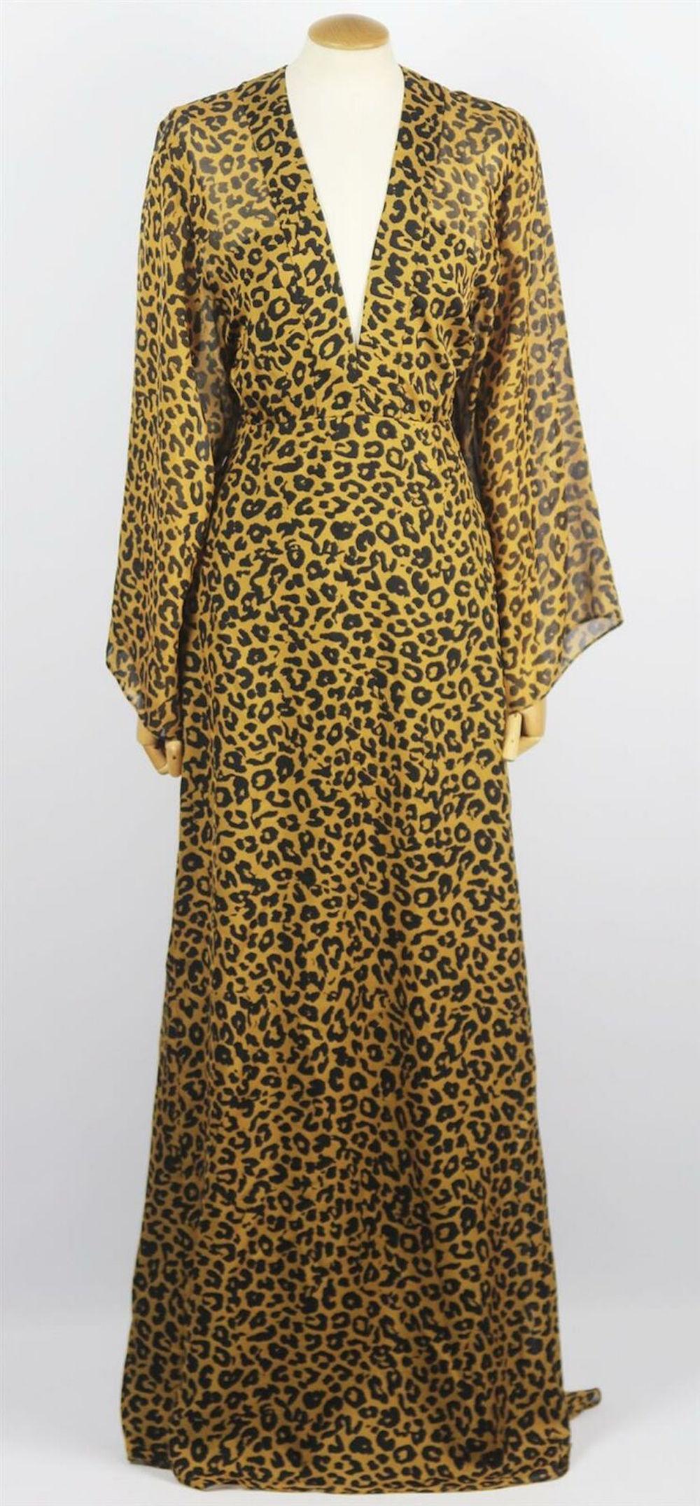 This dress has been made from lightweight silk-chiffon, Michelle Mason's dress is flatteringly cut with a wrap-effect and plunging neckline that drapes into a long silhouette.
Leopard-print silk-chiffon.
Concealed hook and zip fastening at