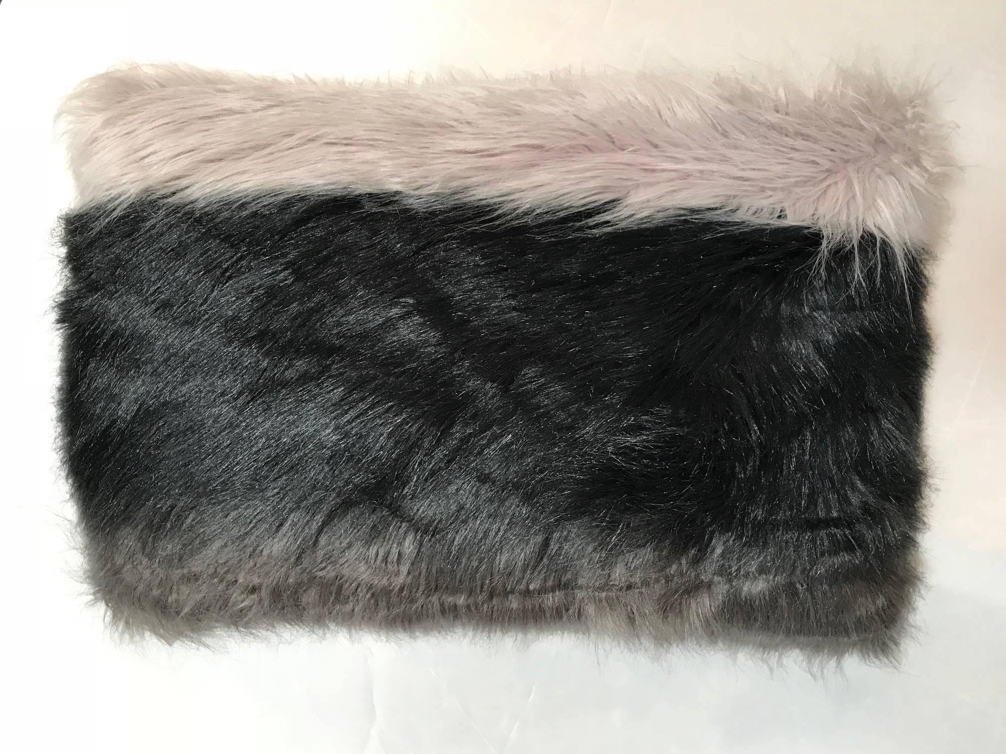 This uniquely crafted pillow is extremely soft to the touch on one side and culturally rich on the other. With reclaimed genuine African mudcloth fabric and faux Italian fur, this item combines style and comfort in a way which only Michelle