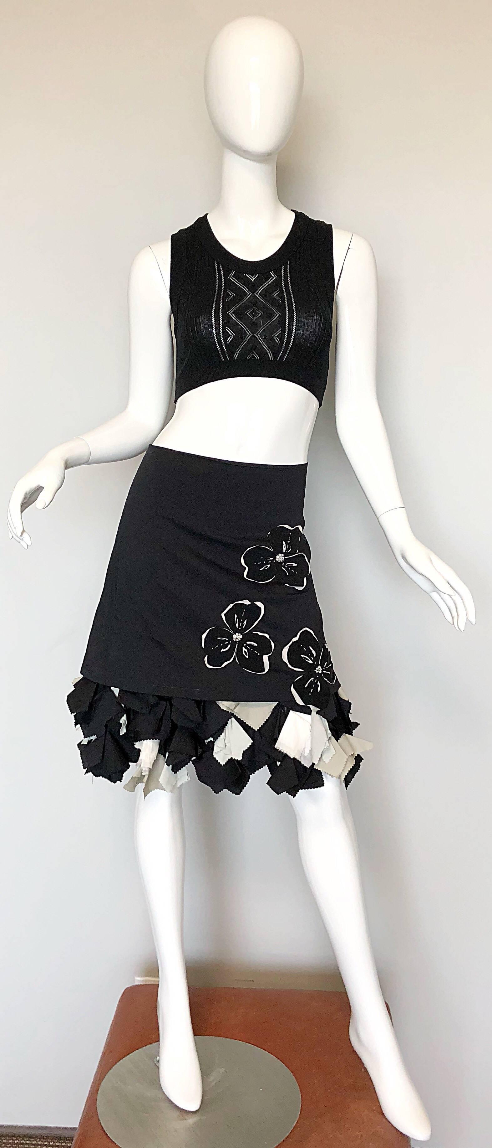 Rare MICHELLE TAN 1990s black and white origami rhinestone skirt! Features a cotton overlay mini skirt over an attached origami encrusted longer skirt. Overlay features flower appliqués with rhinestones throughout. Hidden zipper up the back with
