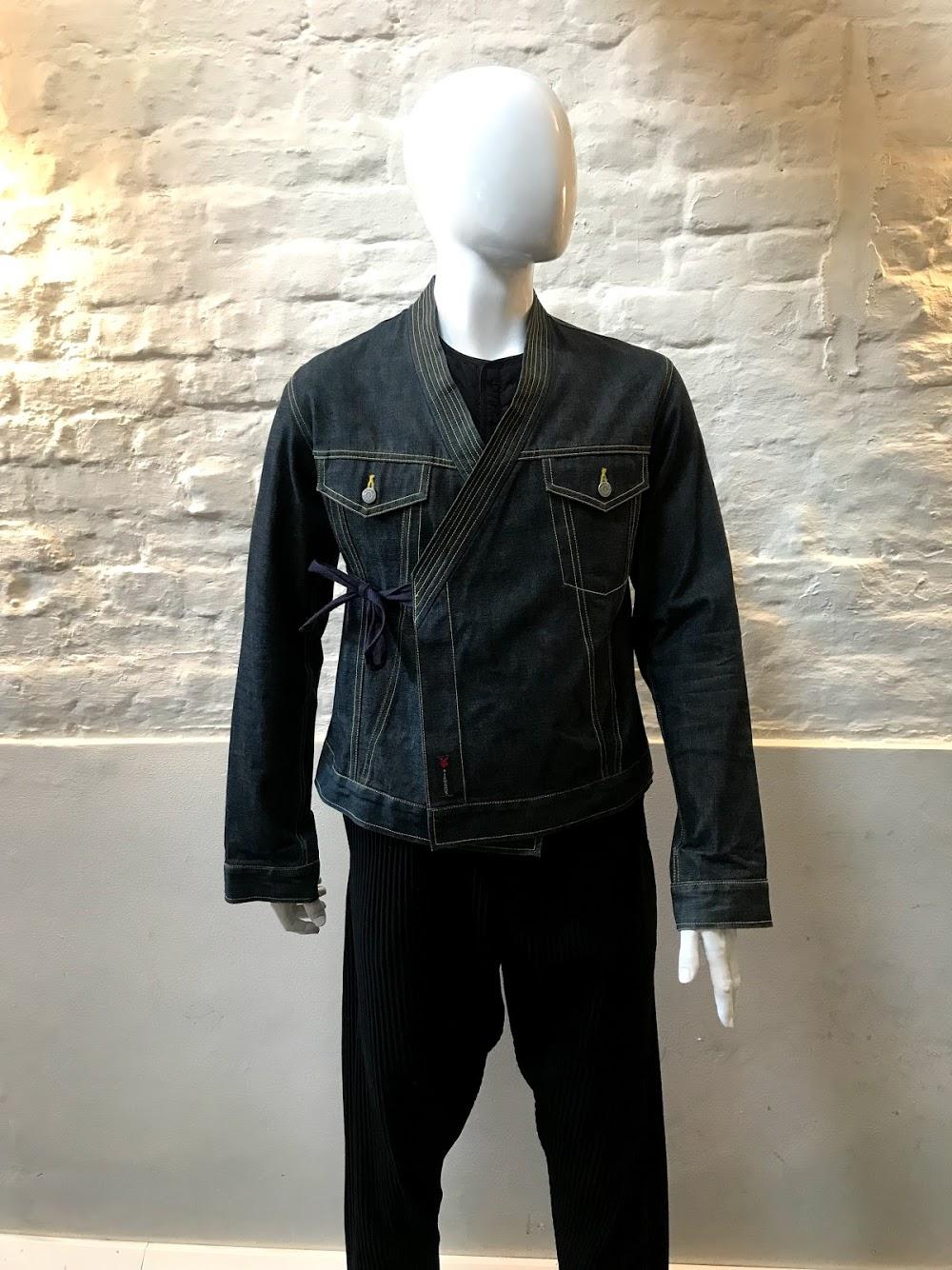 Michiko Koshino Kimono Tie Denim jacket made in Belgium. 

Respected by London’s fashion community as one of the industry’s original innovators, Michiko Koshino was among the wave of Japanese talent to descend into Europe during the early 80’s,