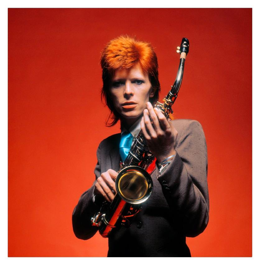 Bowie And Sax - Limited Edition Mick Rock Estate Print 

David Bowie with saxophone, 1973.  (photo Mick Rock).

All prints are numbered by the Estate.
Edition size varies according to print size.

Unframed Archival Pigment Print
Print Size: 16 x 16"