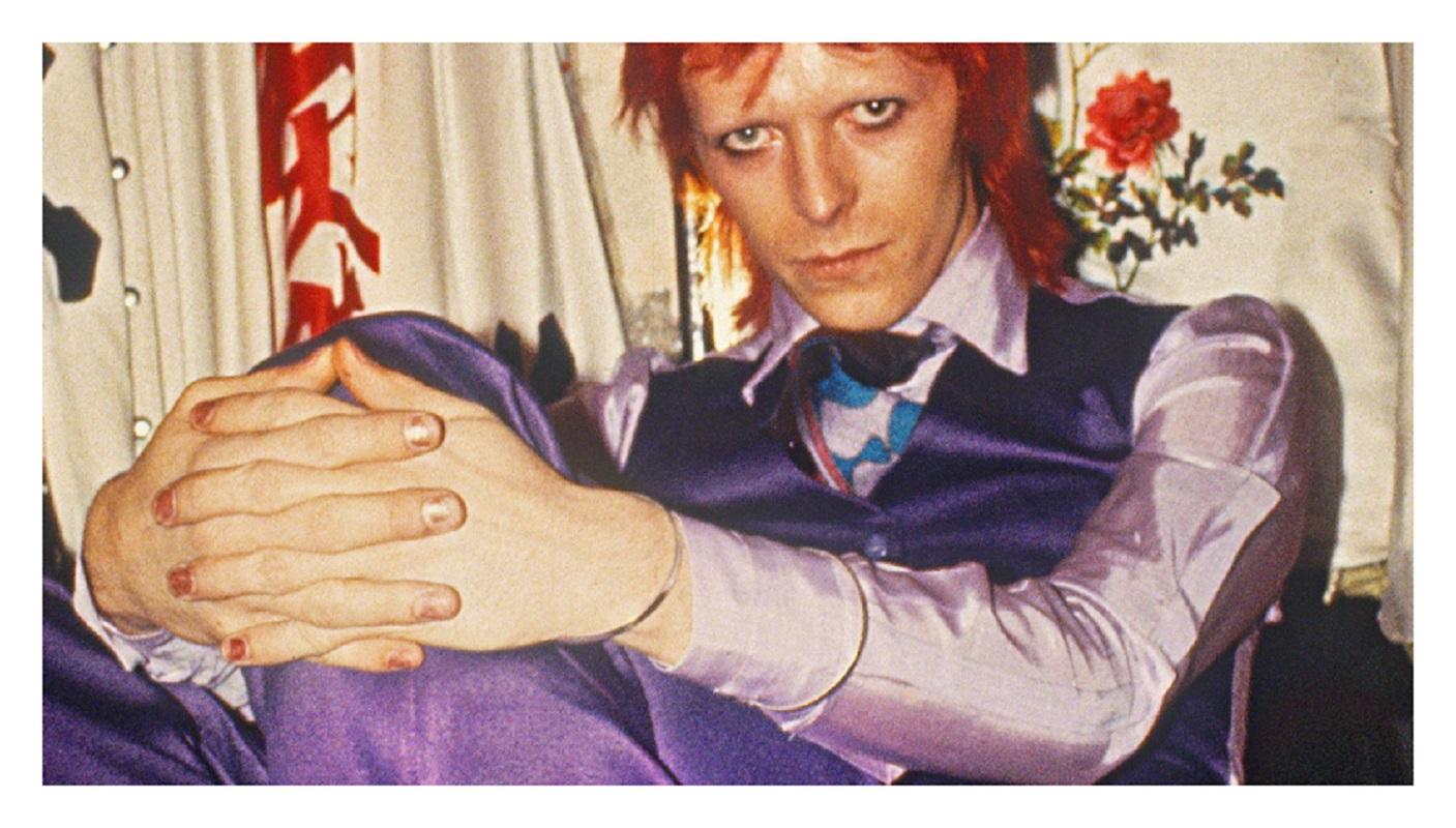 David Bowie - Limited Edition Mick Rock Estate Print 

David Bowie in purple suit, backstage, 1973 (photo Mick Rock).

All prints are numbered by the Estate.
Edition size varies according to print size.

Unframed Archival Pigment Print
Print Size: