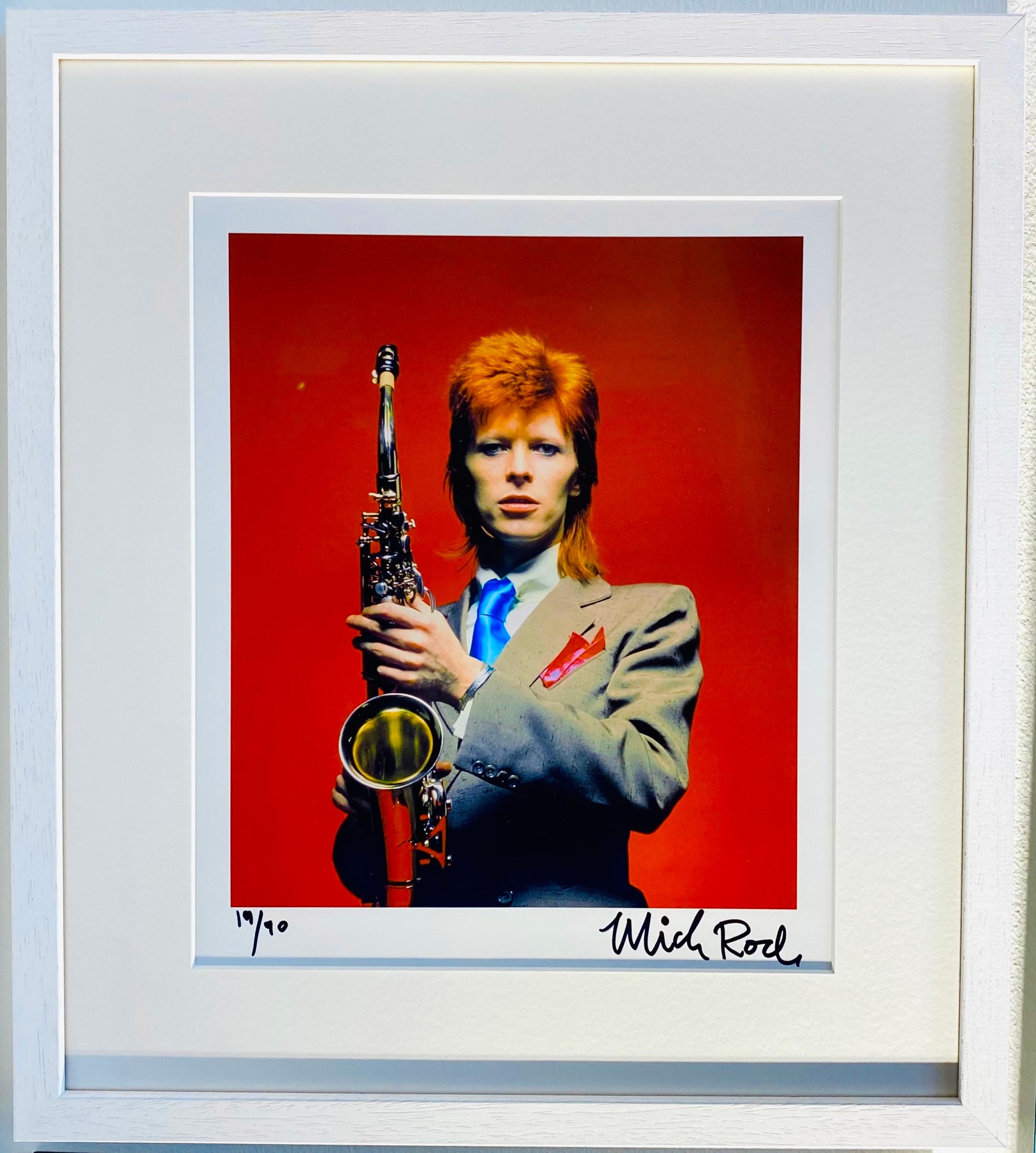 David Bowie with Saxophone (encadré) Édition limitée signée à la main - Beige Color Photograph par Mick Rock