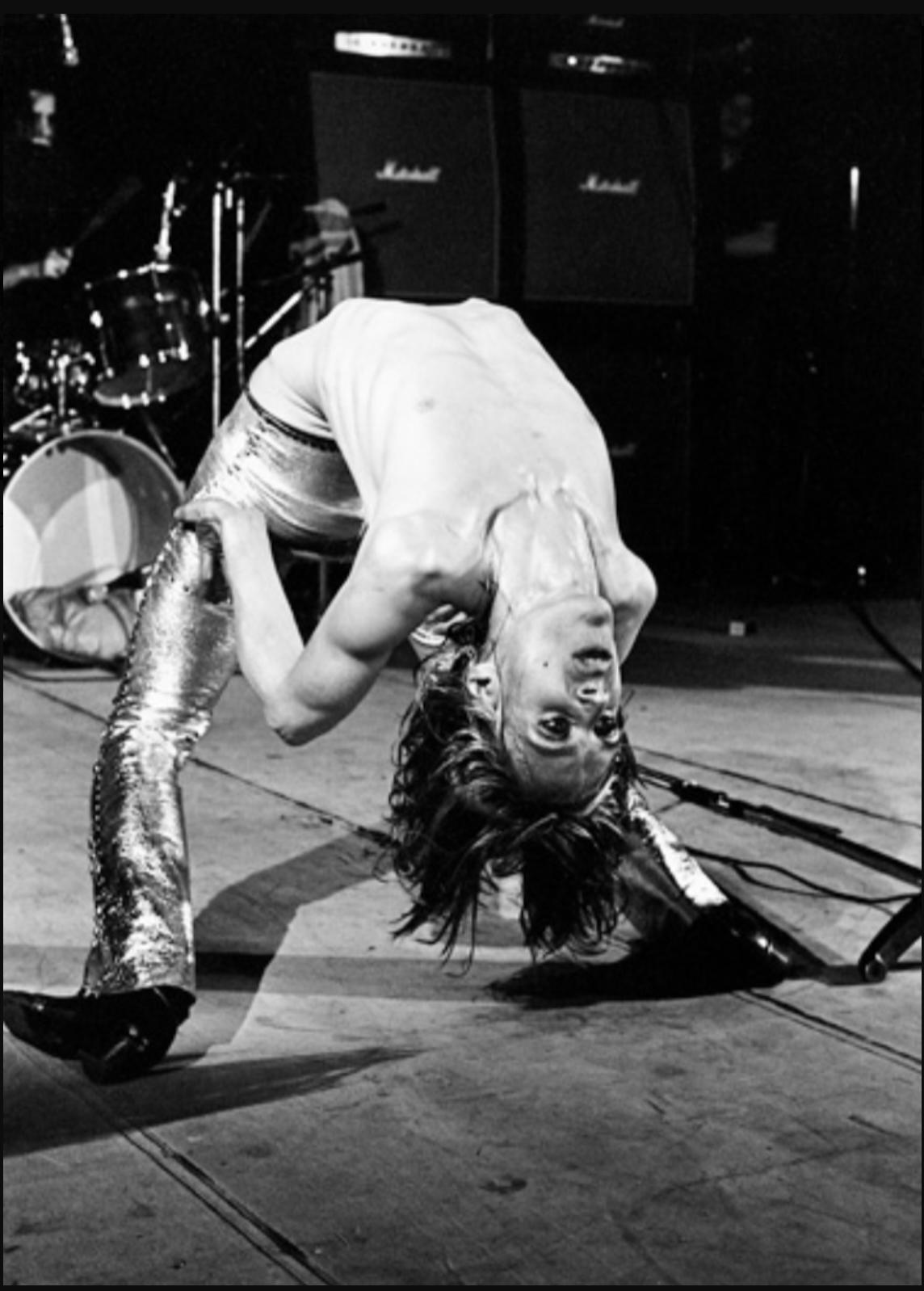 "Iggy Backbend, London, 1972" Photography 24" x 20" inch 29/50 by Mick Rock

Edition: 29/50
Medium: Silver gelatin limited edition photographic print on paper

Iggy and The Stooges were highly influential in the development of punk rock and