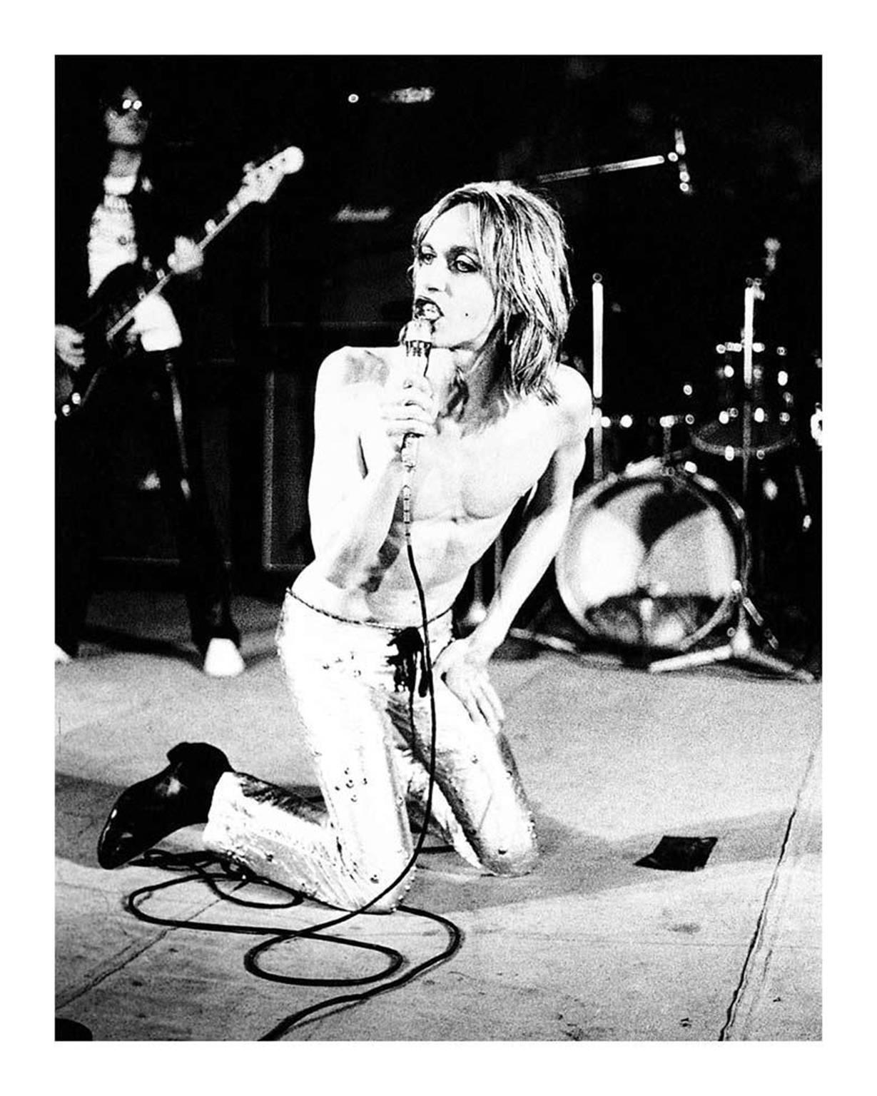 Mick Rock Black and White Photograph – Iggy Pop on Knees