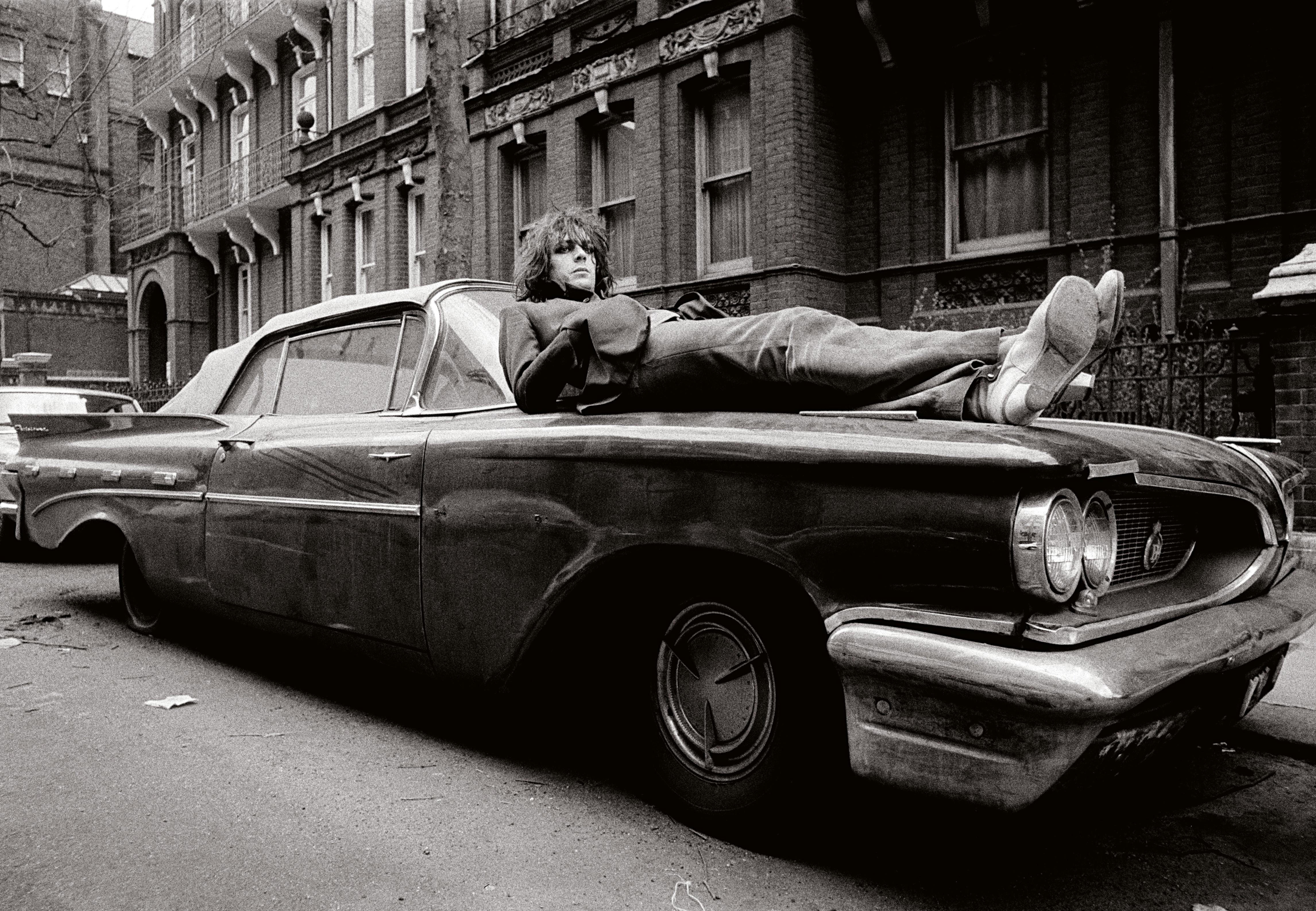 "Syd Barrett Laying on His Car" Photography 20" x 24" inch 29/50 by Mick Rock

Edition: 29/50
Signed and numbered by Mick Rock
Medium: Silver gelatin limited edition photographic print on paper

Pink Floyd founding member Syd Barrett rests on the