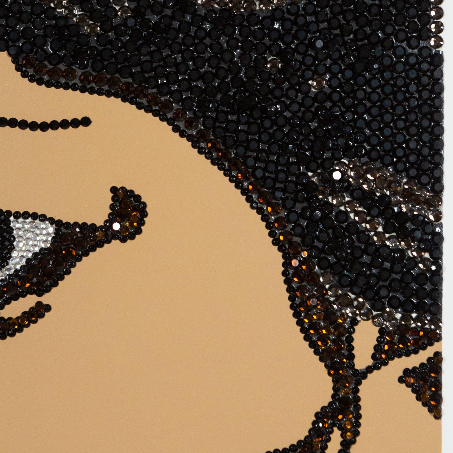 Mickalene Thomas (b.1971) is an American artist exploring the intersection of popular culture and art history, through a contemporary Black female gaze. As an openly gay Black woman, sexuality and race are essential themes in Thomas'
