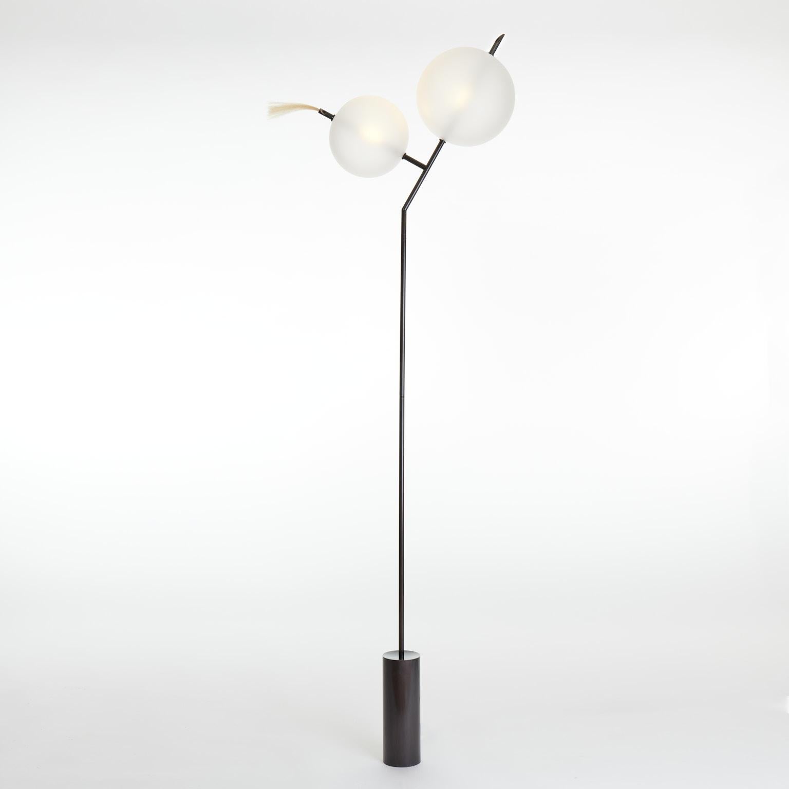 A playful nod, as the name suggests, to the world of cartoons, Mickey floor light is a Minimalist contemporary standing lamp composed of two closely positioned glass spheres of different sizes.
As an option, on request, the horsehair detail can