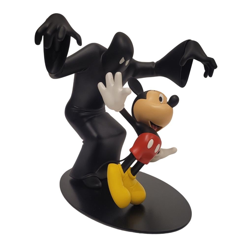 Original and fun figure of Mickey Mouse and the Phantom Blot. Both pieces are made of resin, on a metal base. This is a limited and numbered edition, made in 2010 by the French firm Leblon Delienne. This figure alludes to the first appearance of the