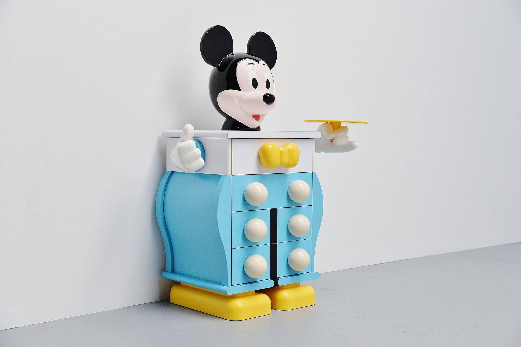 Iconic chest of drawers designed by Pierre Colleu and manufactured by Starform under Disney License, France 1988. This cabinet is completely made of laminated wood and plastic and has four drawers for storage. Who wouldn't want Mickey Mouse in his