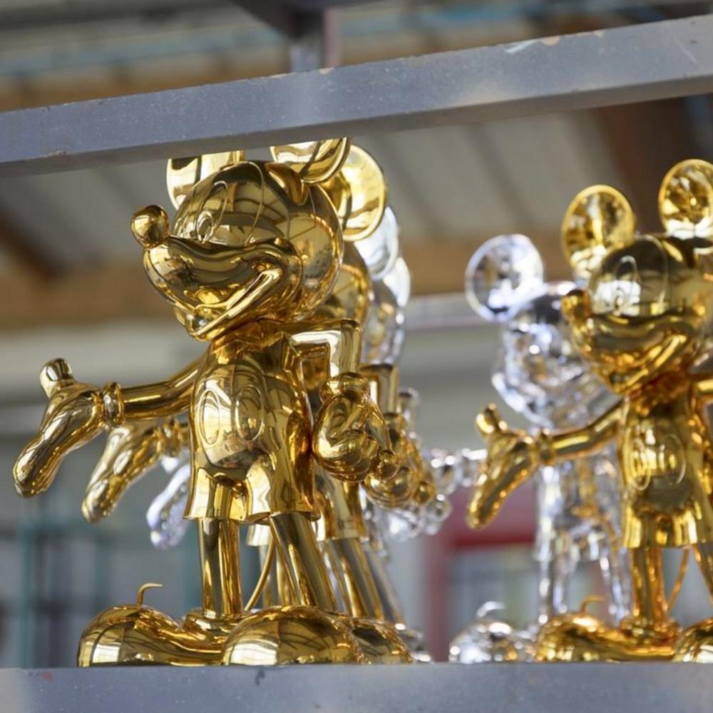gold mickey mouse statue