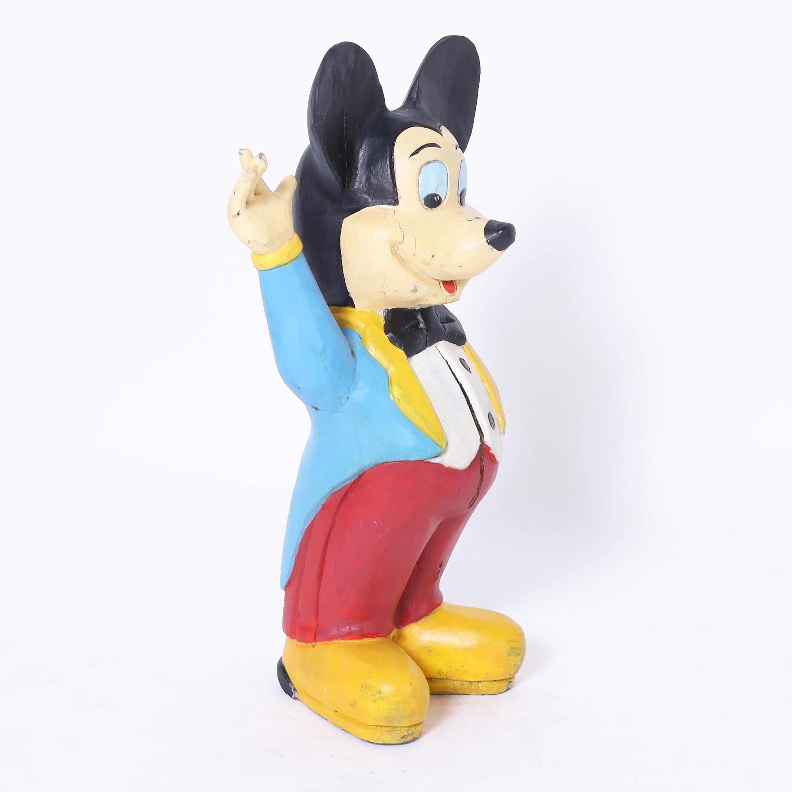 Whimsical Mickey Mouse wood sculpture hand carved and painted in his blue tuxedo. 