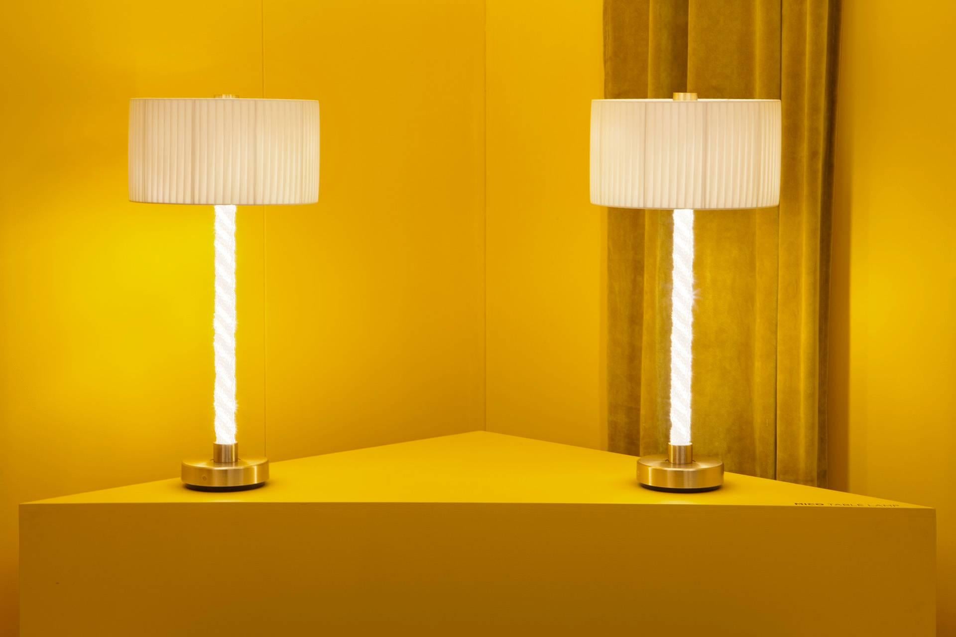 The Mico Table Lamp belongs to the Mico series that explores the concept and experience of pure light, personifying Baroncelli’s commitment to progressive design and exceptional craftsmanship. 

The framework is bound by strands of cristallo glass