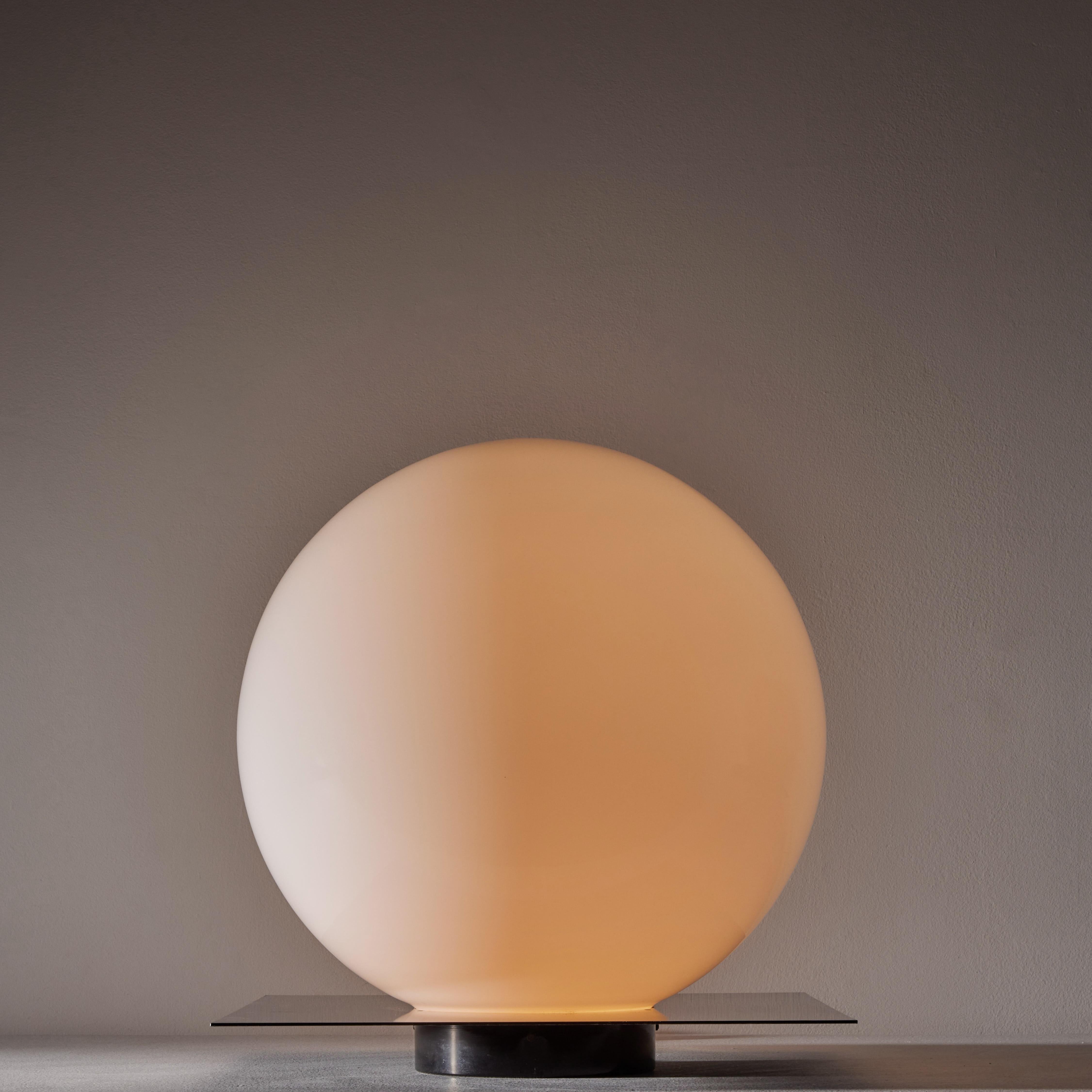 Micol table lamp by Sergio Mazza and Giuliana Gramigna for Quattrifolio. Designed and manufactured in Italy, circa 1970's. Opaline glass diffuser, enameled metal base. Original EU cord. We recommend one E27 100w maximum bulb. Bulbs not included.