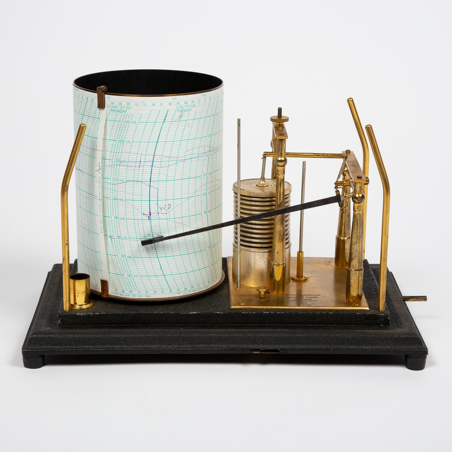 An open scale Micro-barograph by Short & Mason of London in enameled glass case.

Number: 551/41

Seven day clockwork drive by Horstmann Gear Co Ltd, of Bath. Serial number: 7027/59

With Meteorological Office “MO” logo.

Meteorological