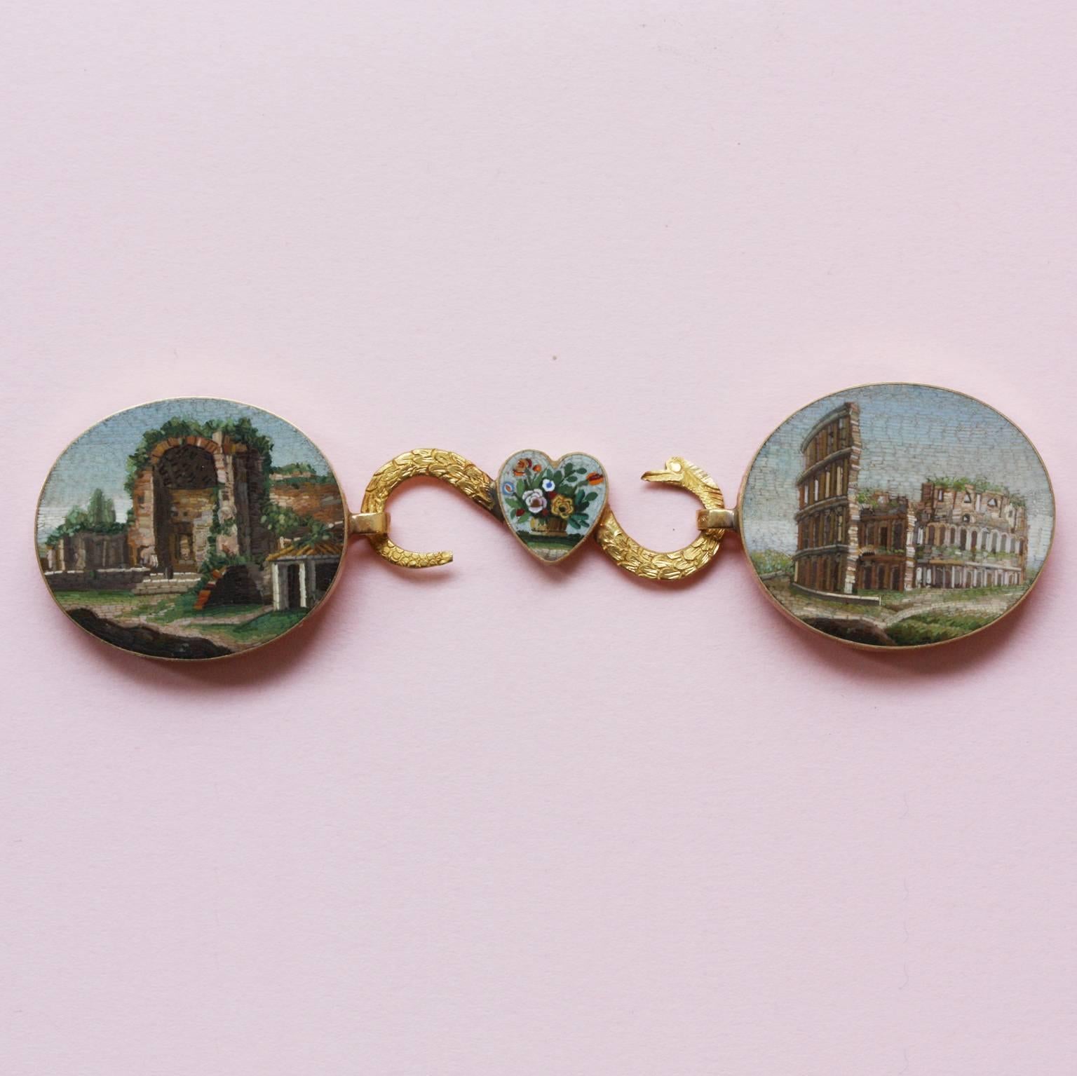 A rare 18-carat gold choker or buckle with two oval micro mosaic plaques depicting the Temple of Venus and Rome and the Coliseum linked together by a snake-shaped link with a heart with a micro mosaic flower basket, with Papal State hallmarks for