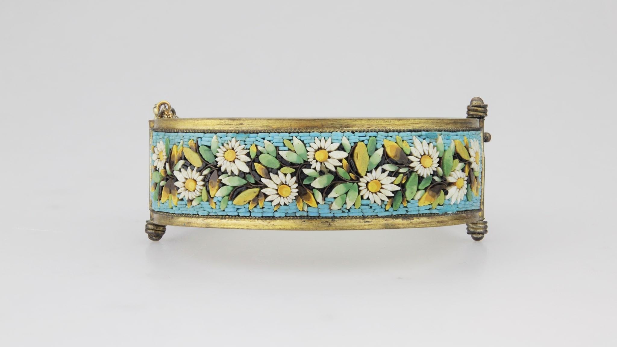 A fine Victorian micro mosaic bracelet with a day and night garden motif. The condition of this particular bracelet is exceptional with all tesserae in tact and only a little wear to the gilt metal finish. The bracelet features a safety chain and a