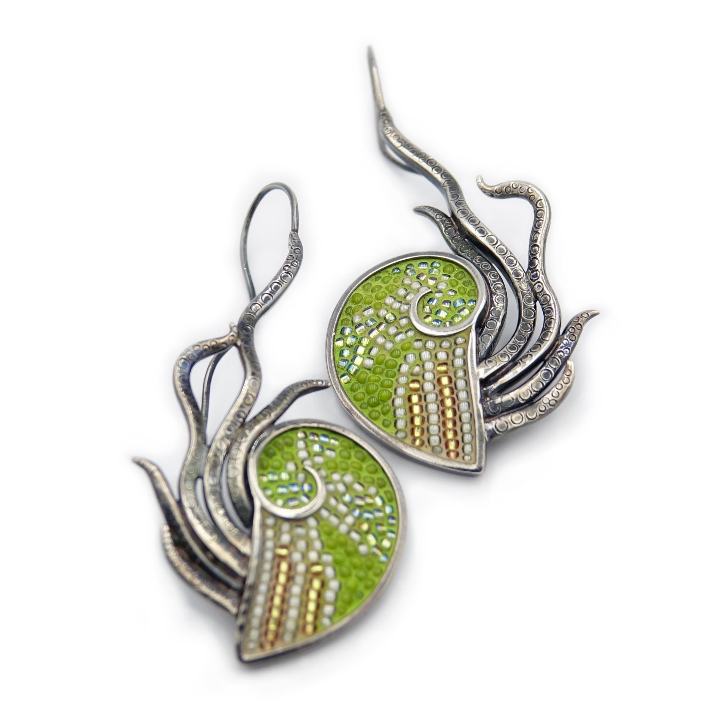 Green micro-mosaic nautilus earrings. Individual glass beads inlaid into a hand-forged sterling silver frame with fixed tentacles, detailed with circular suckers. See separate listing for matching Nautilove pendant.

This pendant is part of a body