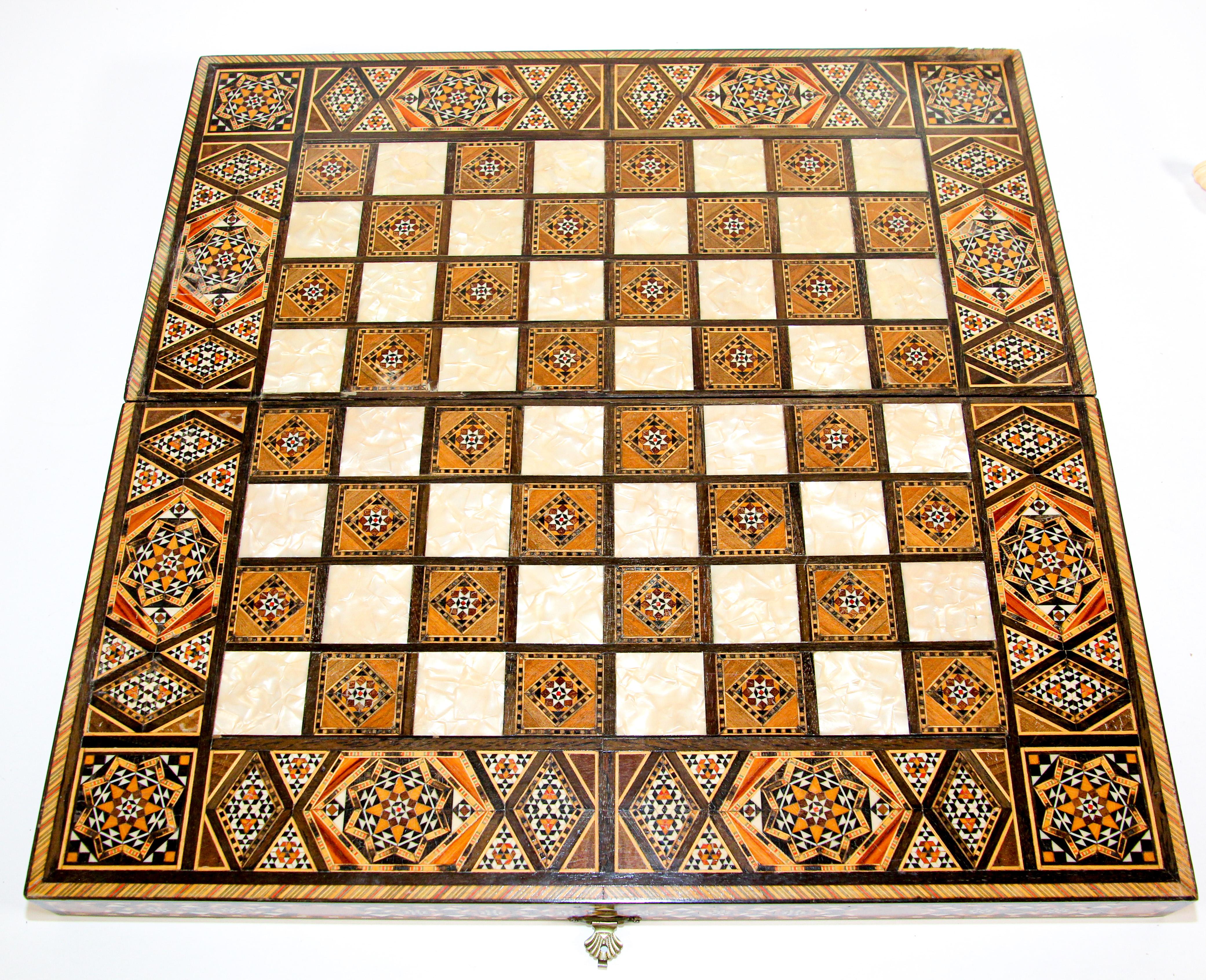 Large vintage Moorish Syrian style micro mosaic Inlay marquetry mosaic backgammon and chess game box.
Amazing craftsmanship intricate marquetry in mosaic Moorish geometric pattern mosaic marquetry inlay and fine precision makes it a true work of